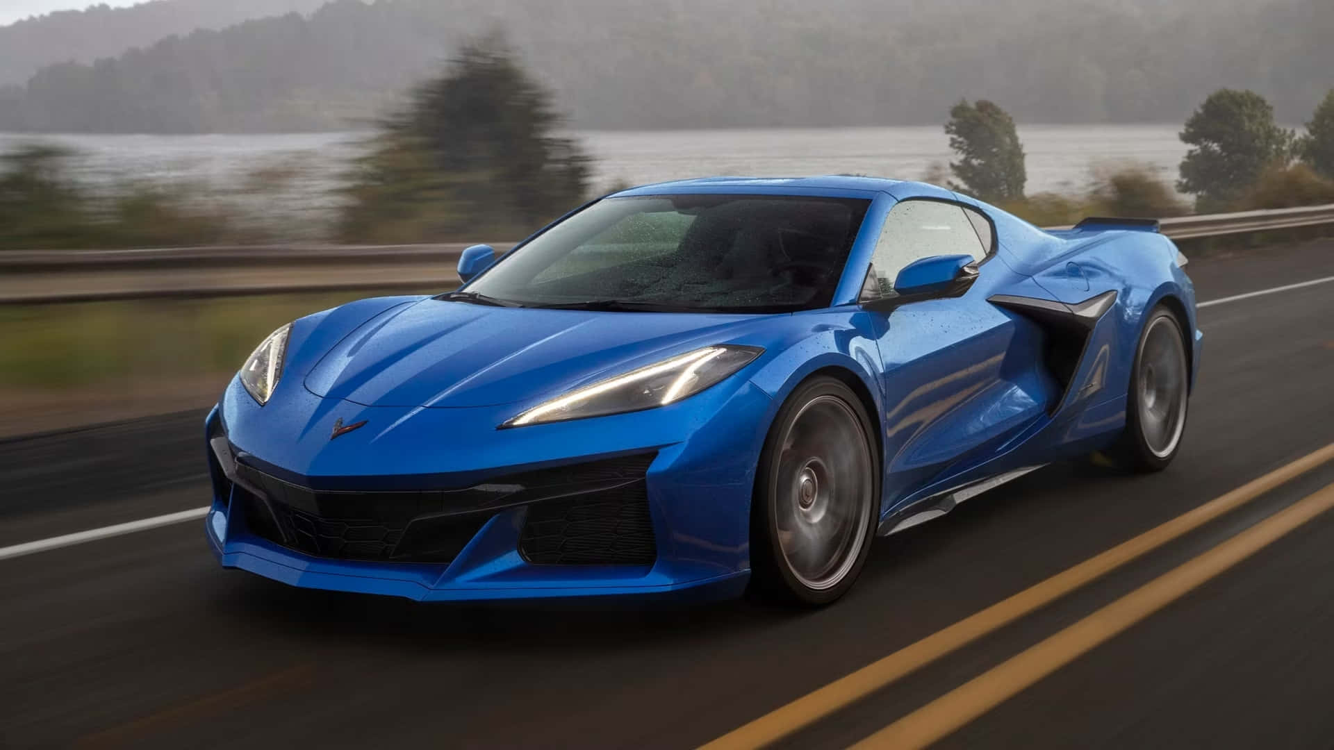 Blue Corvette C8 On The Road Background