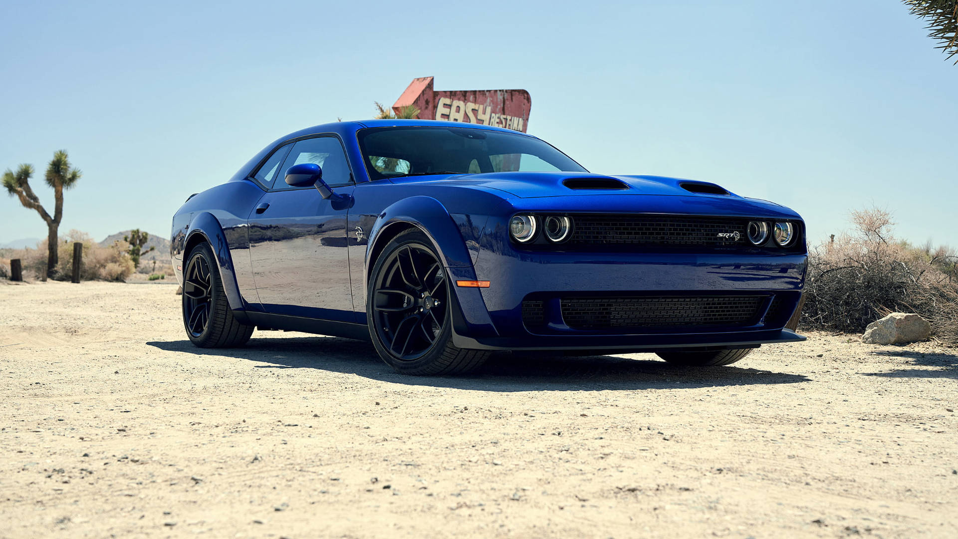 Blue Dodge Challenger In A Desert