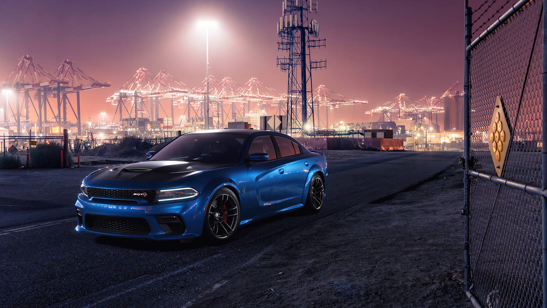 Blue Dodge Challenger In A Port Background