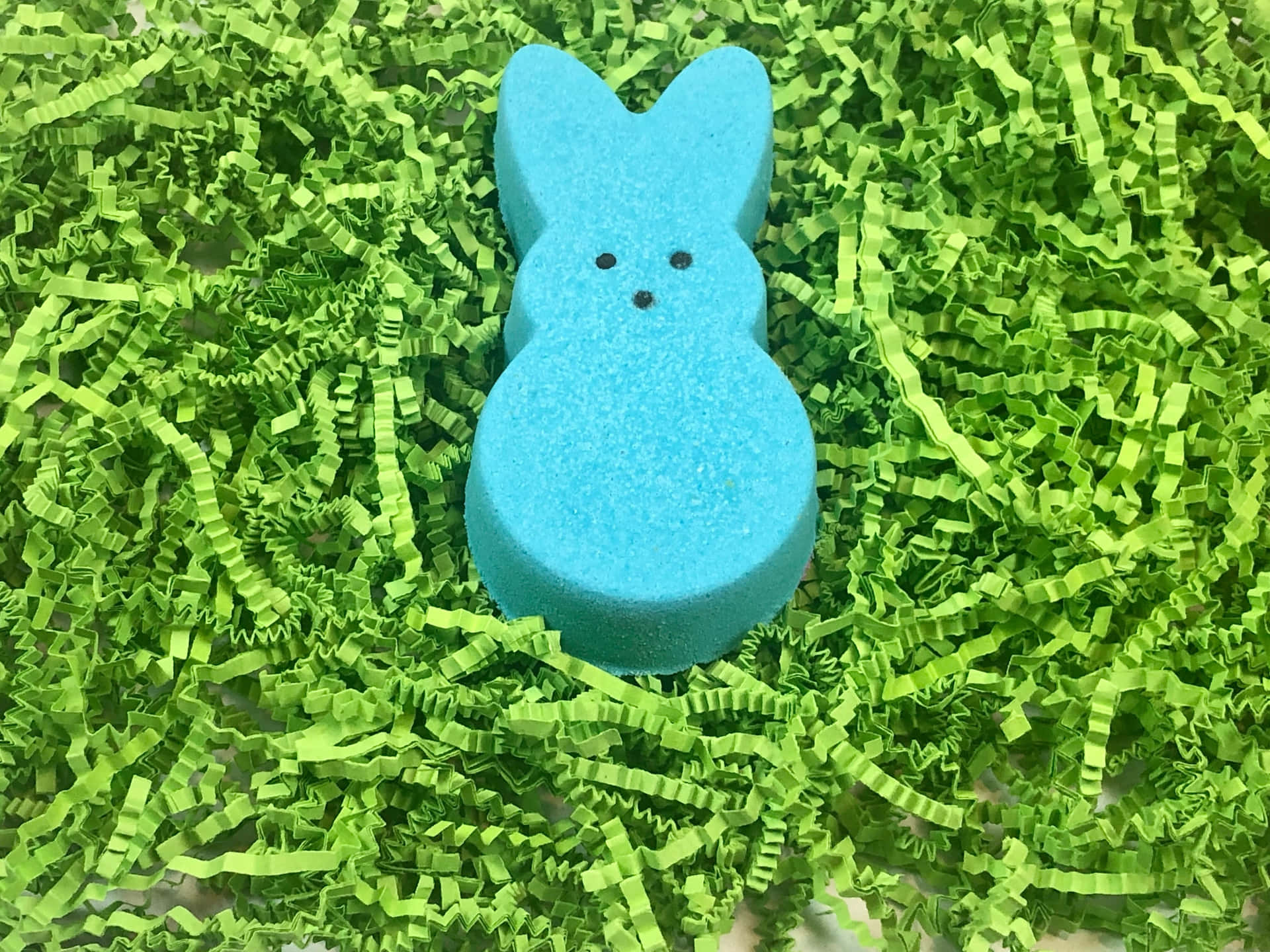 Blue Easter Peepon Green Shredded Paper Background