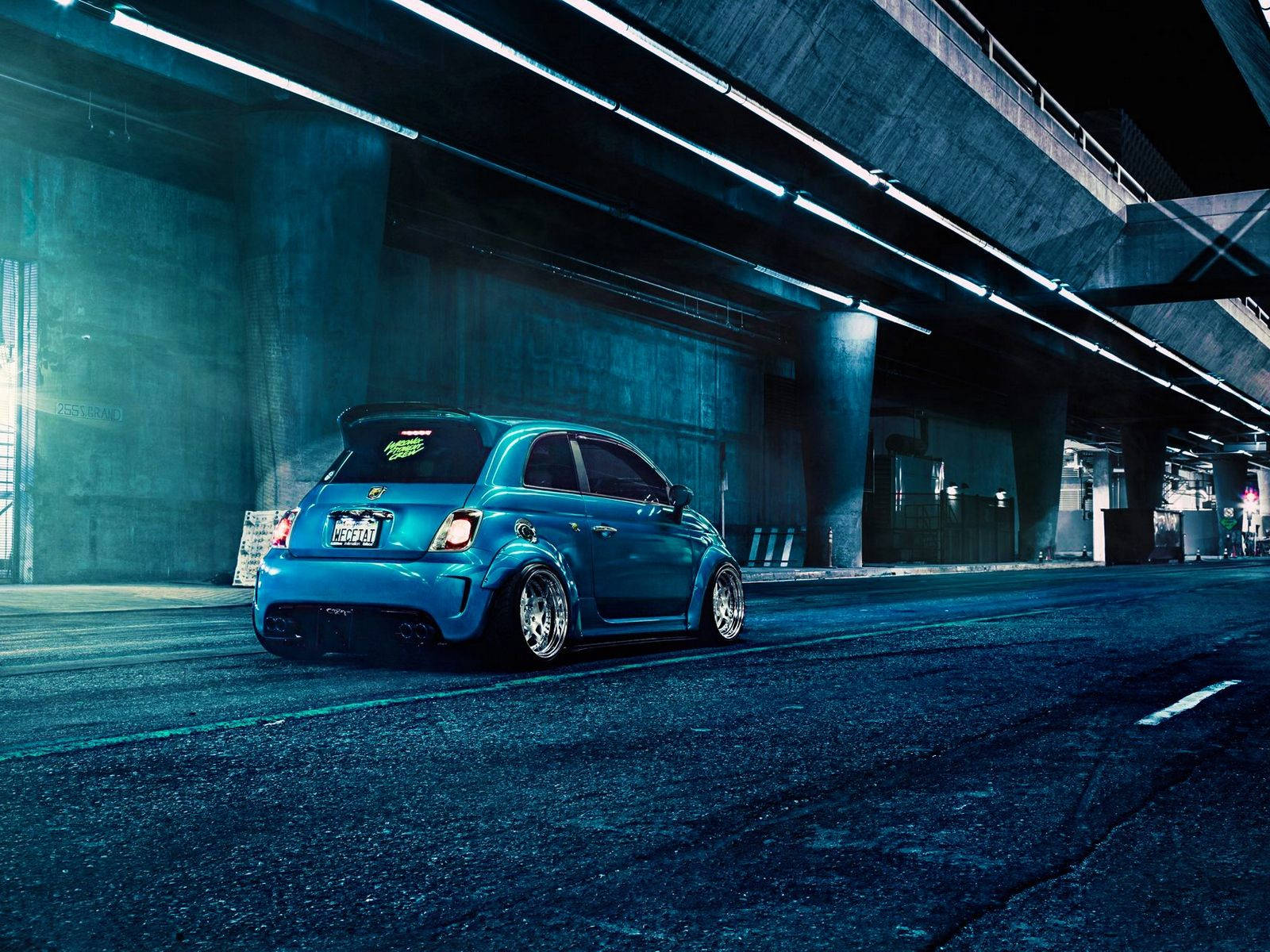 Blue Fiat Abarth 500 Driving Background