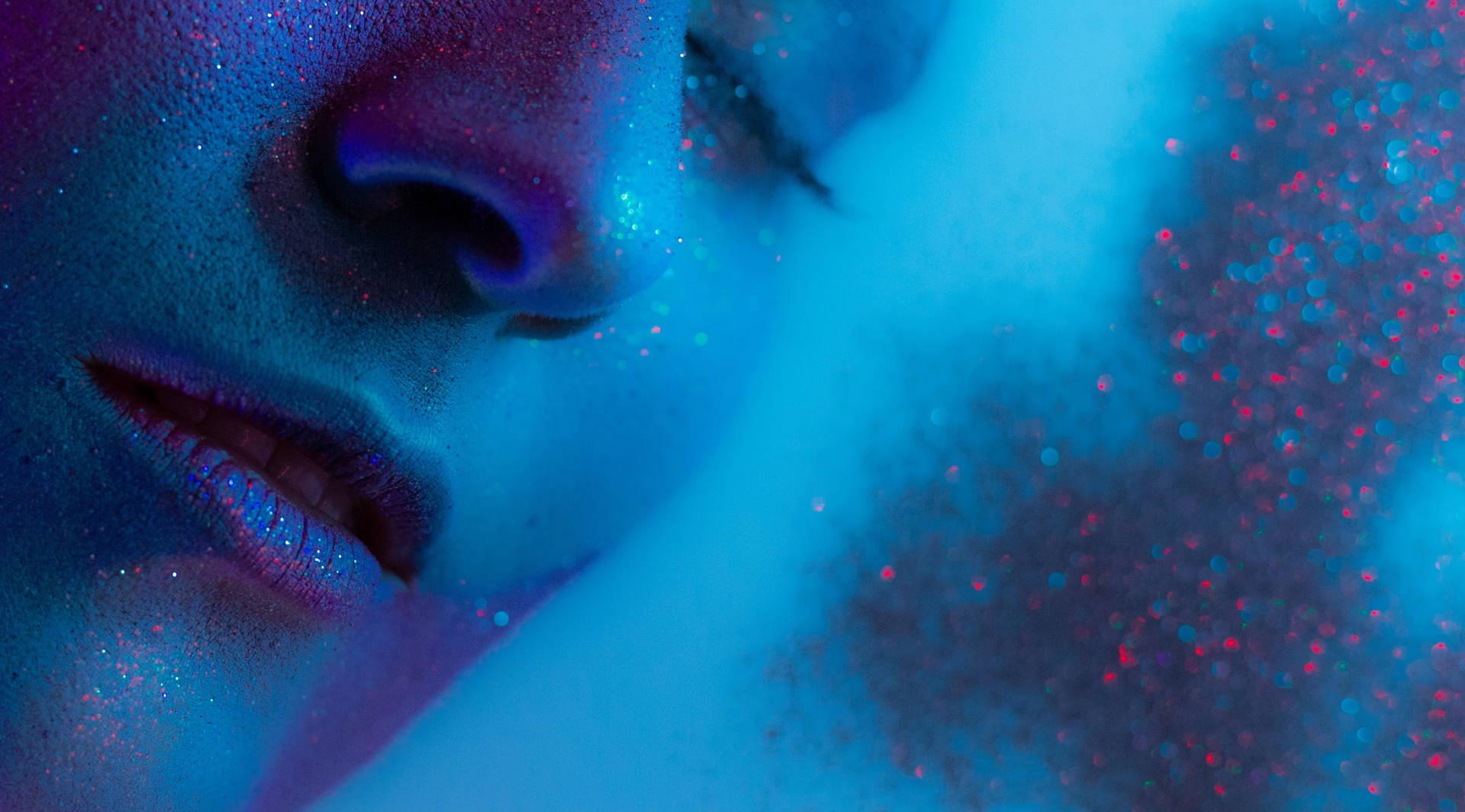 Blue Glitter On Woman's Face Background