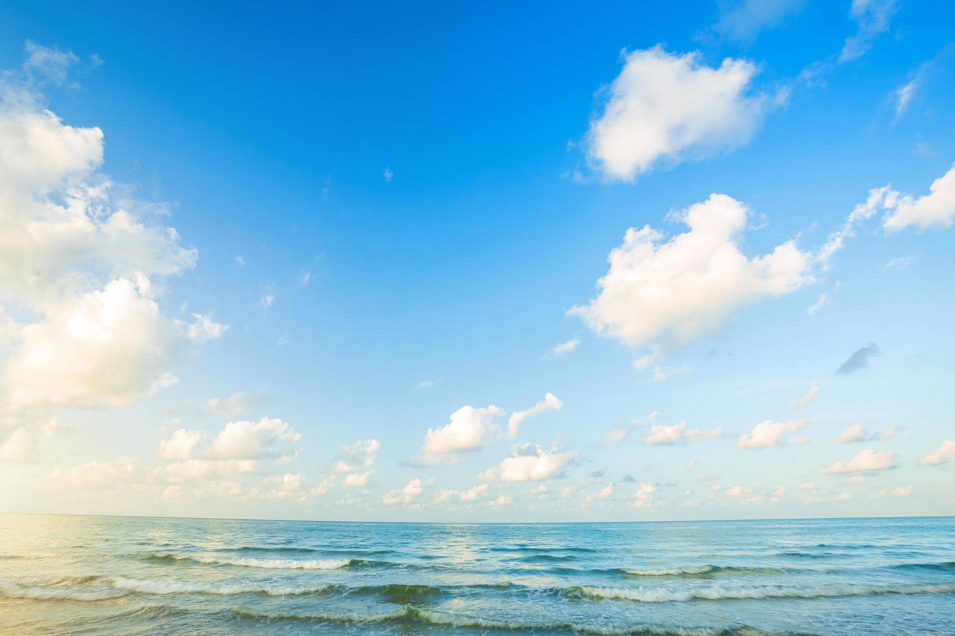 Blue Gradient Horizon With Cottony Clouds