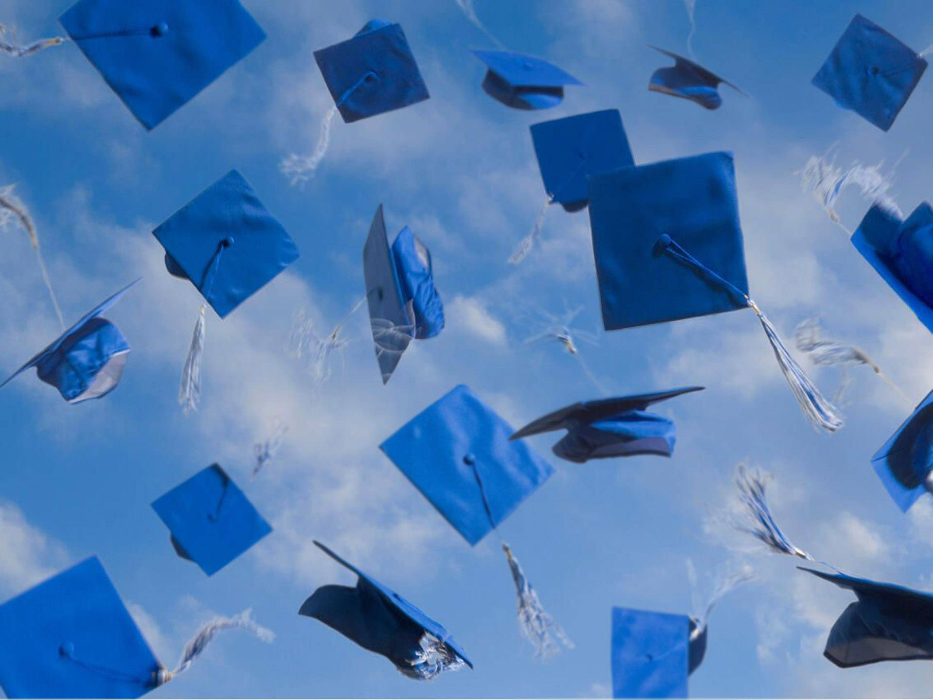 Blue Graduation Hats Background