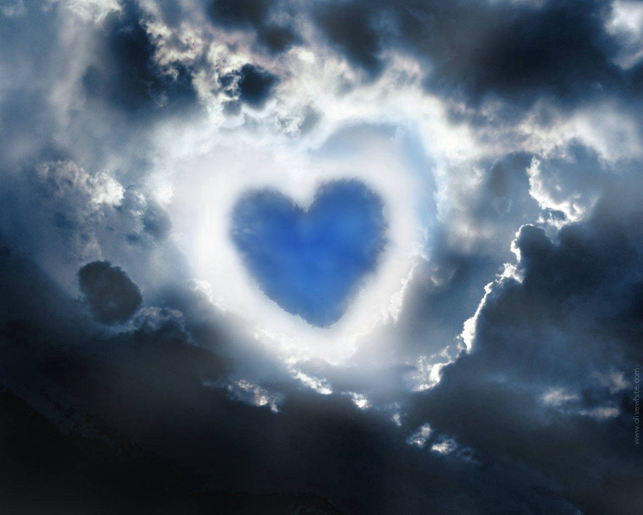 Blue Heart In Dark Sky Background