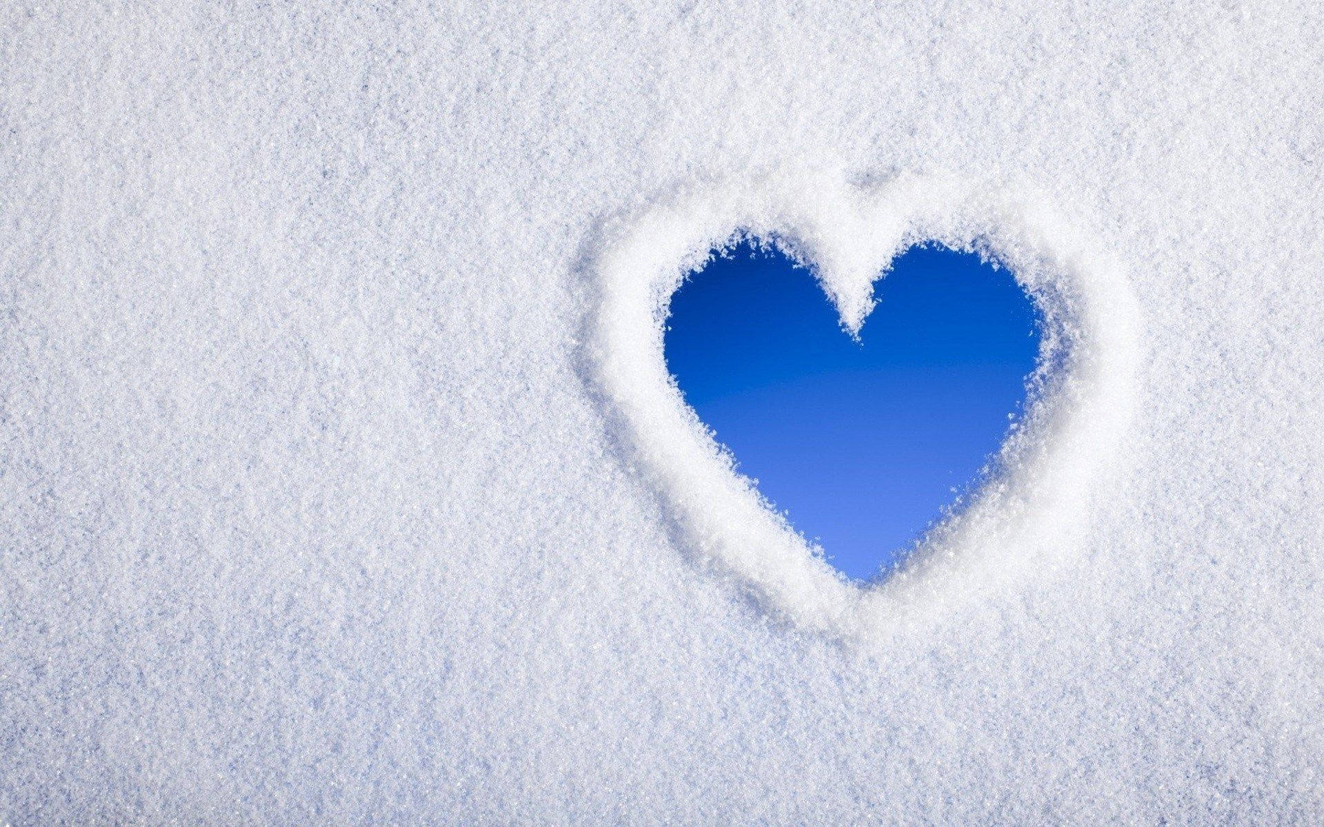 Blue Heart In White Snow Background
