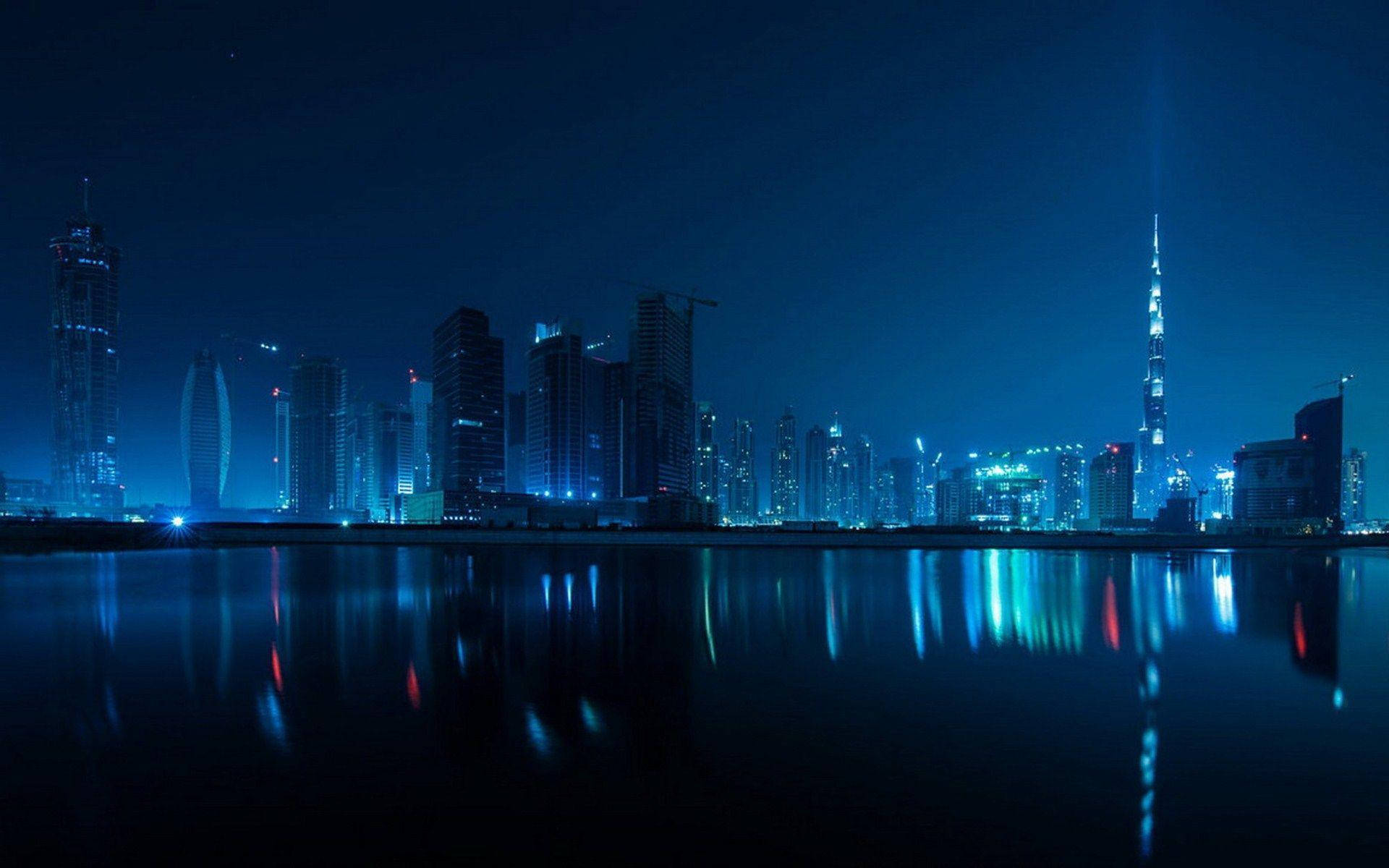 Blue Lit Dubai Skyline Buildings Background