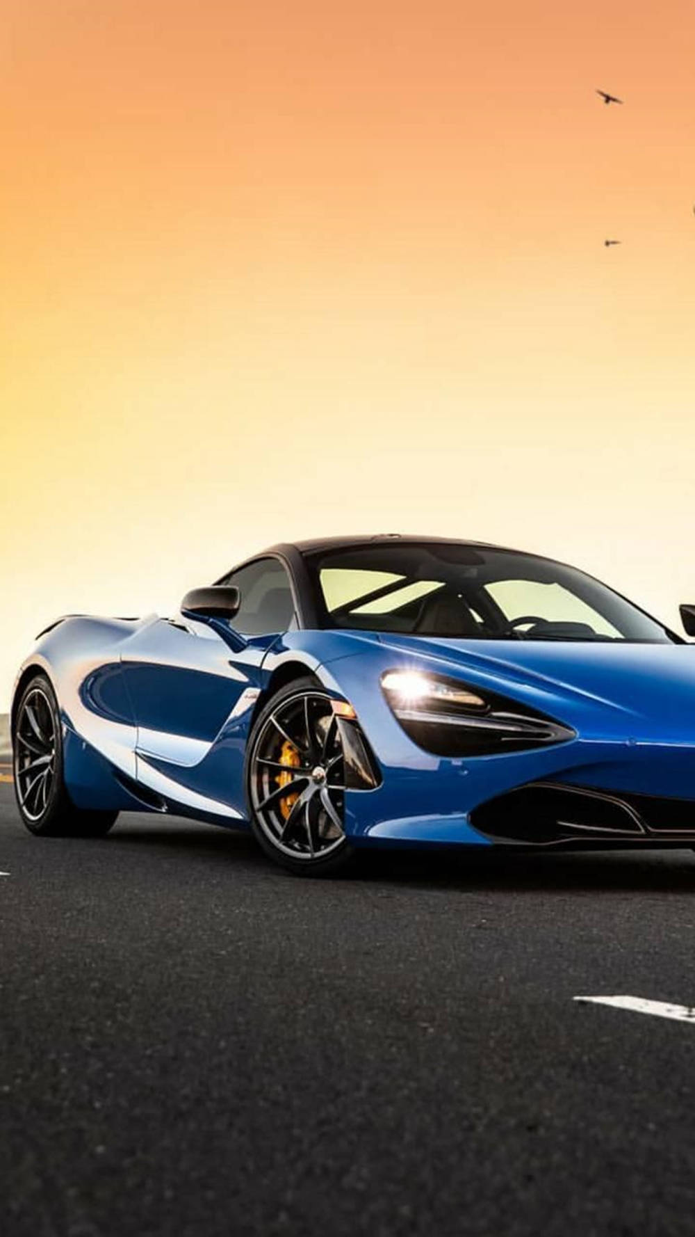 Blue Mclaren 720s Under Sunset Phone Background