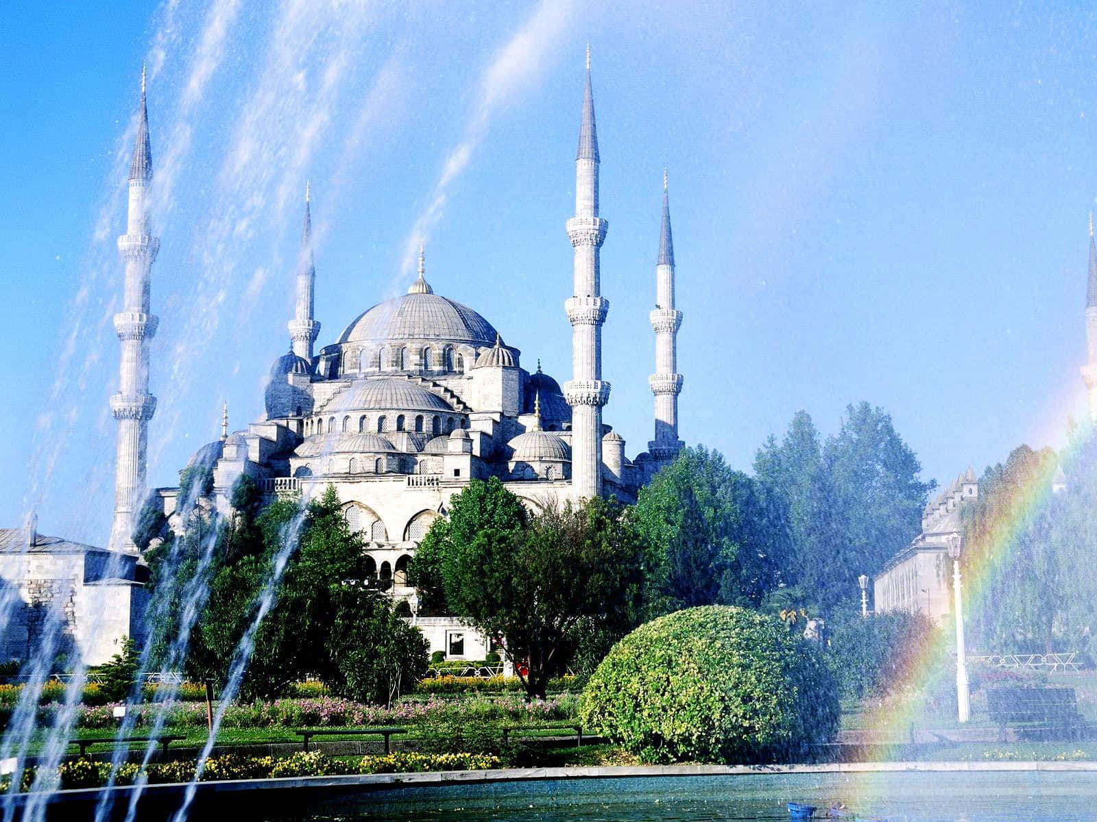 Blue Mosque In Blue Sky With Rainbow Background
