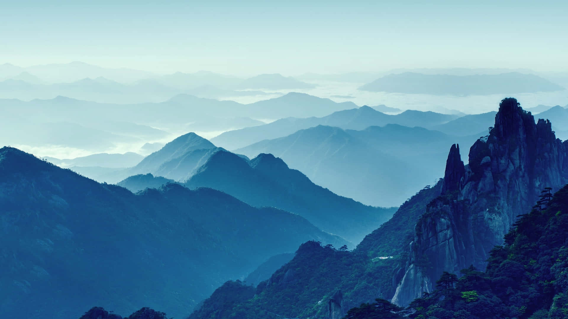 Blue Mountain On A Foggy Day Background