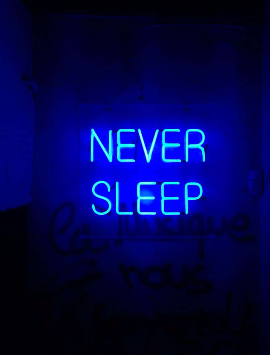 Blue Neon Never Sleep Sign Background