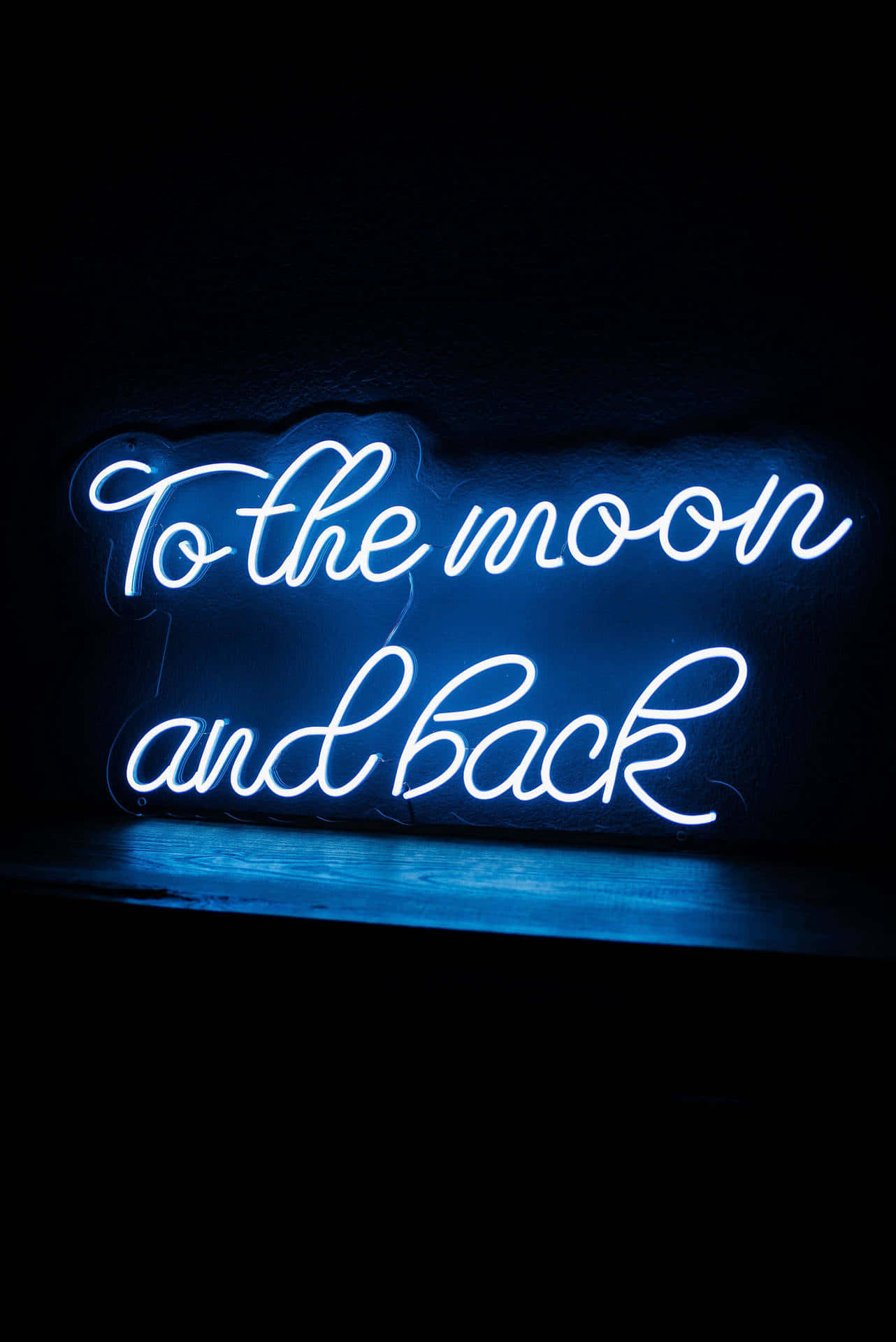 Blue Neon Sign To The Moon And Back Background