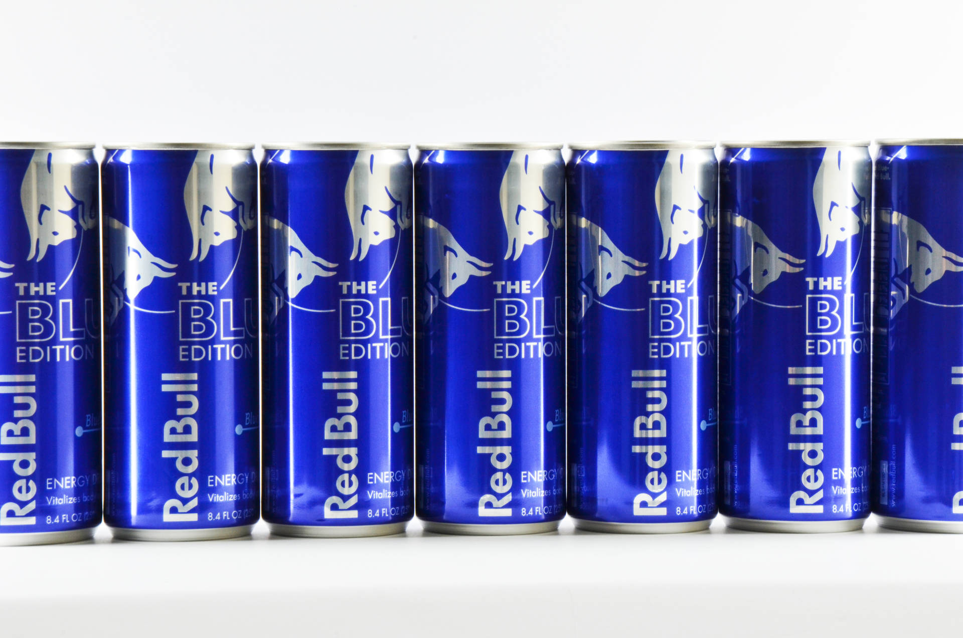Blue Red Bull Cans Lined Up
