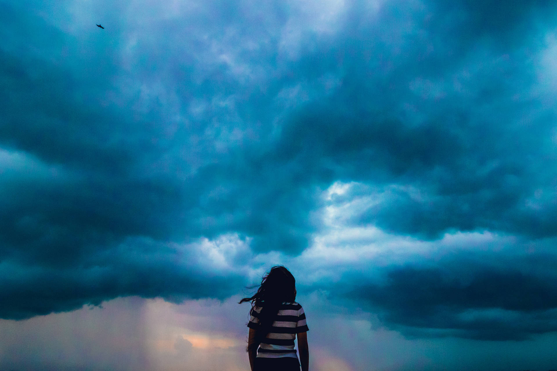 Blue Storm Clouds Over Girl Background