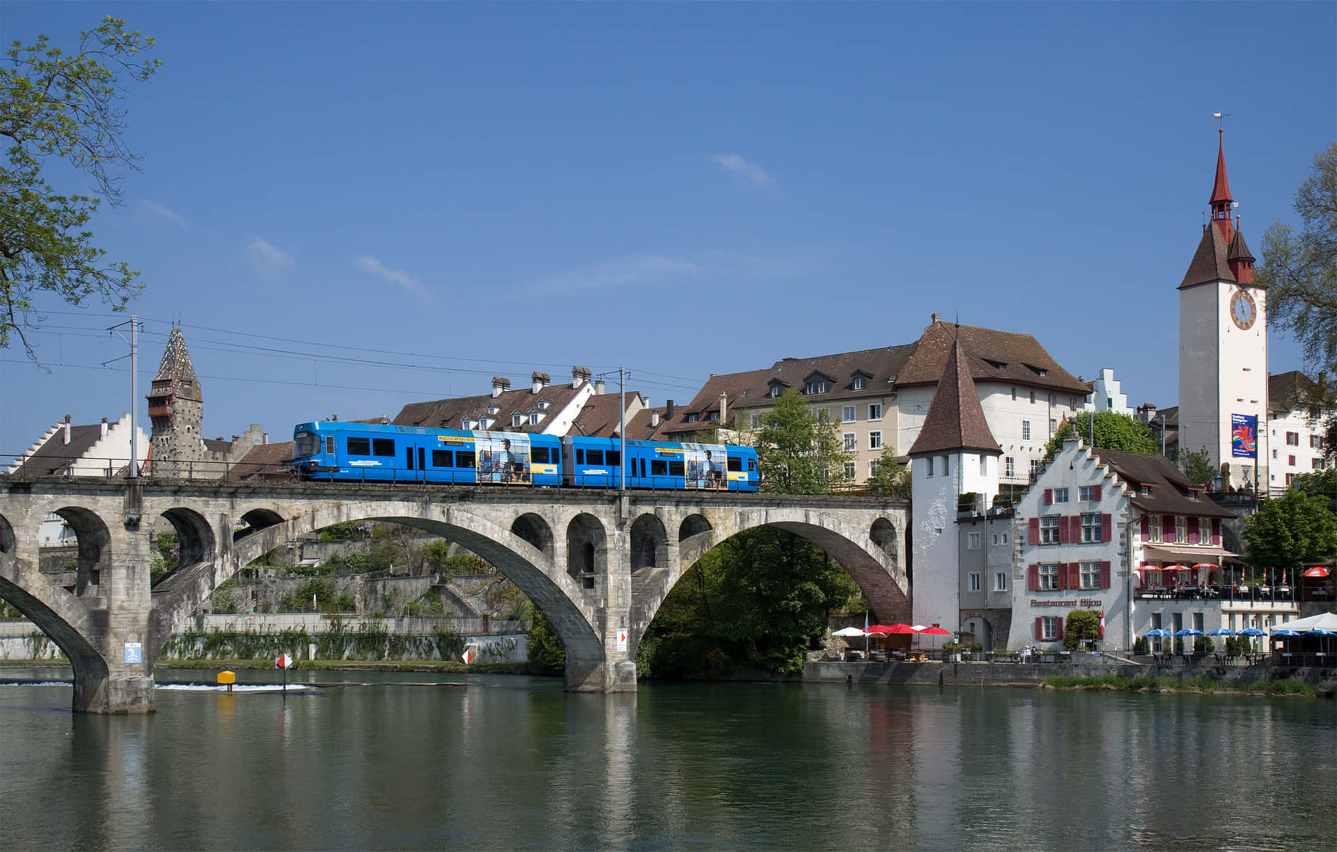 Blue_ Train_ Crossing_ Stone_ Bridge Background