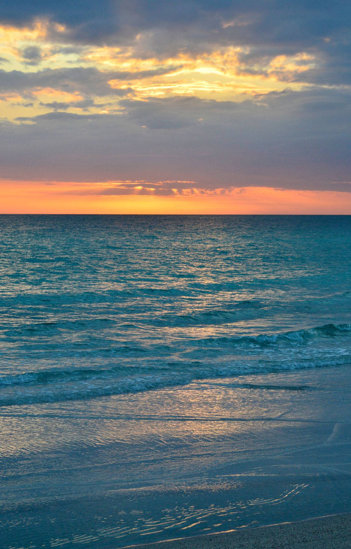 Blue Wavy Beach Sunrise Background