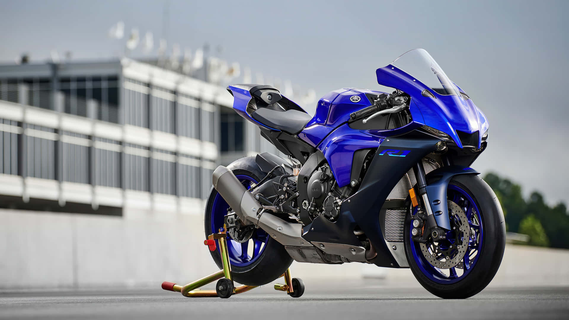 Blue Yamaha Sportbike Racetrack Ready Background