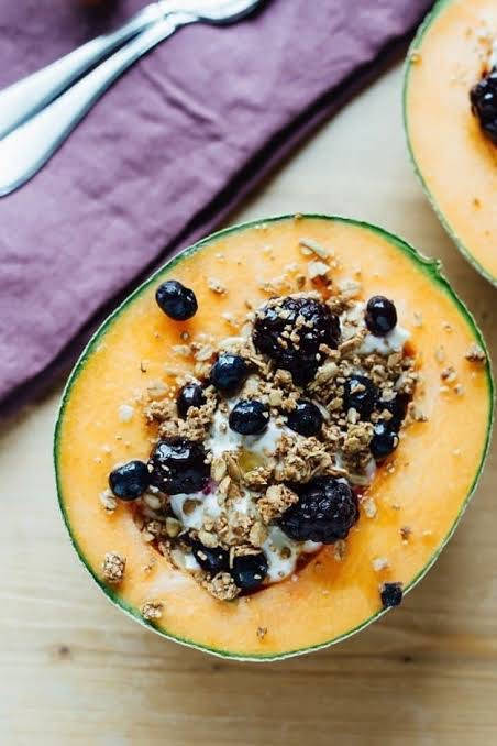 Blueberries On Cantaloupe Background