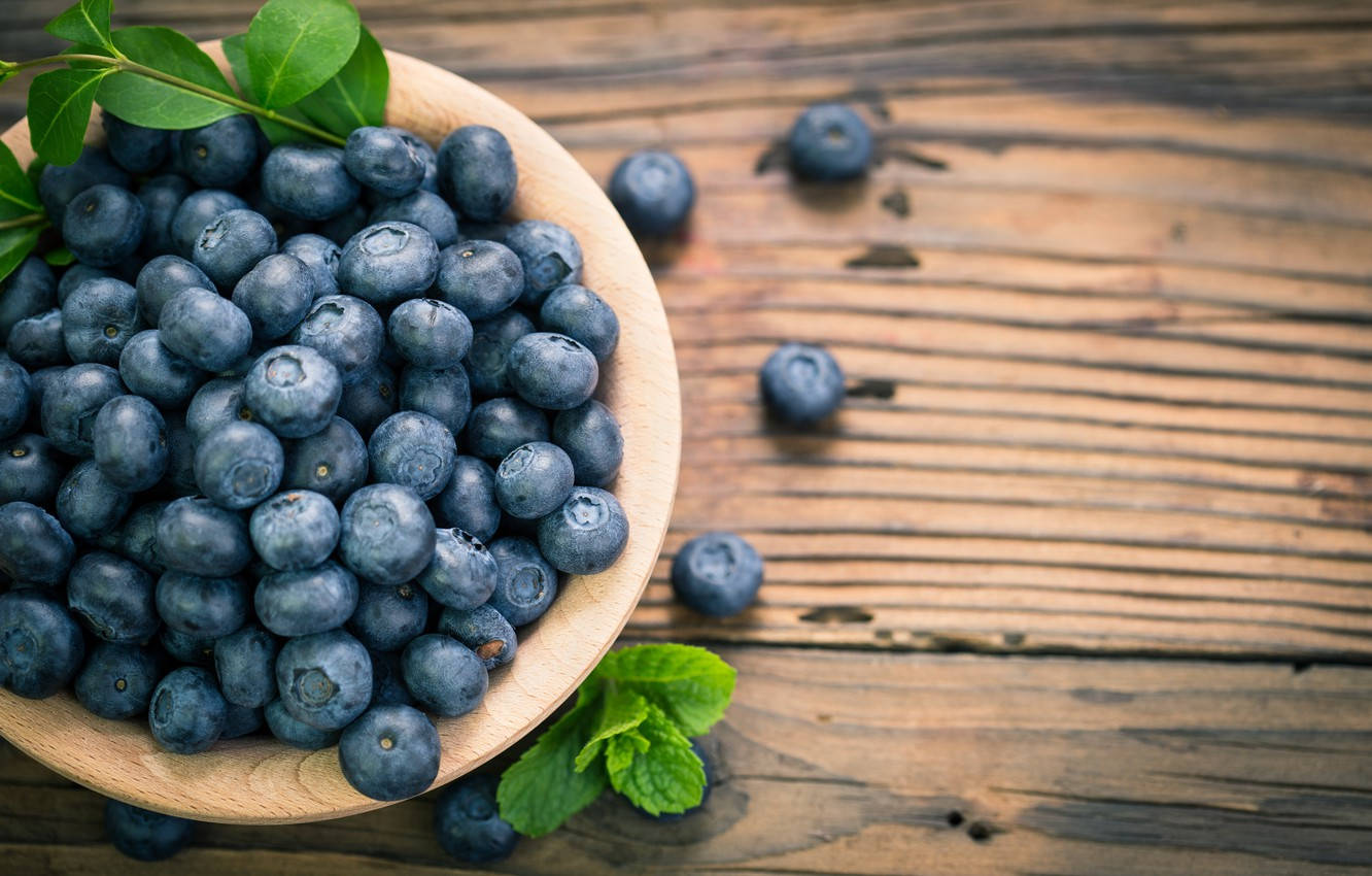 Blueberries On Wooden Bowl