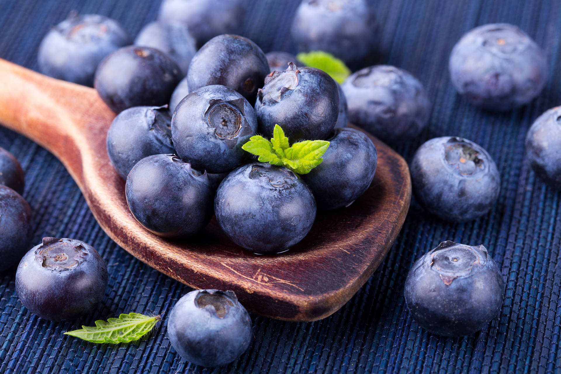 Blueberries On Wooden Spoon Background