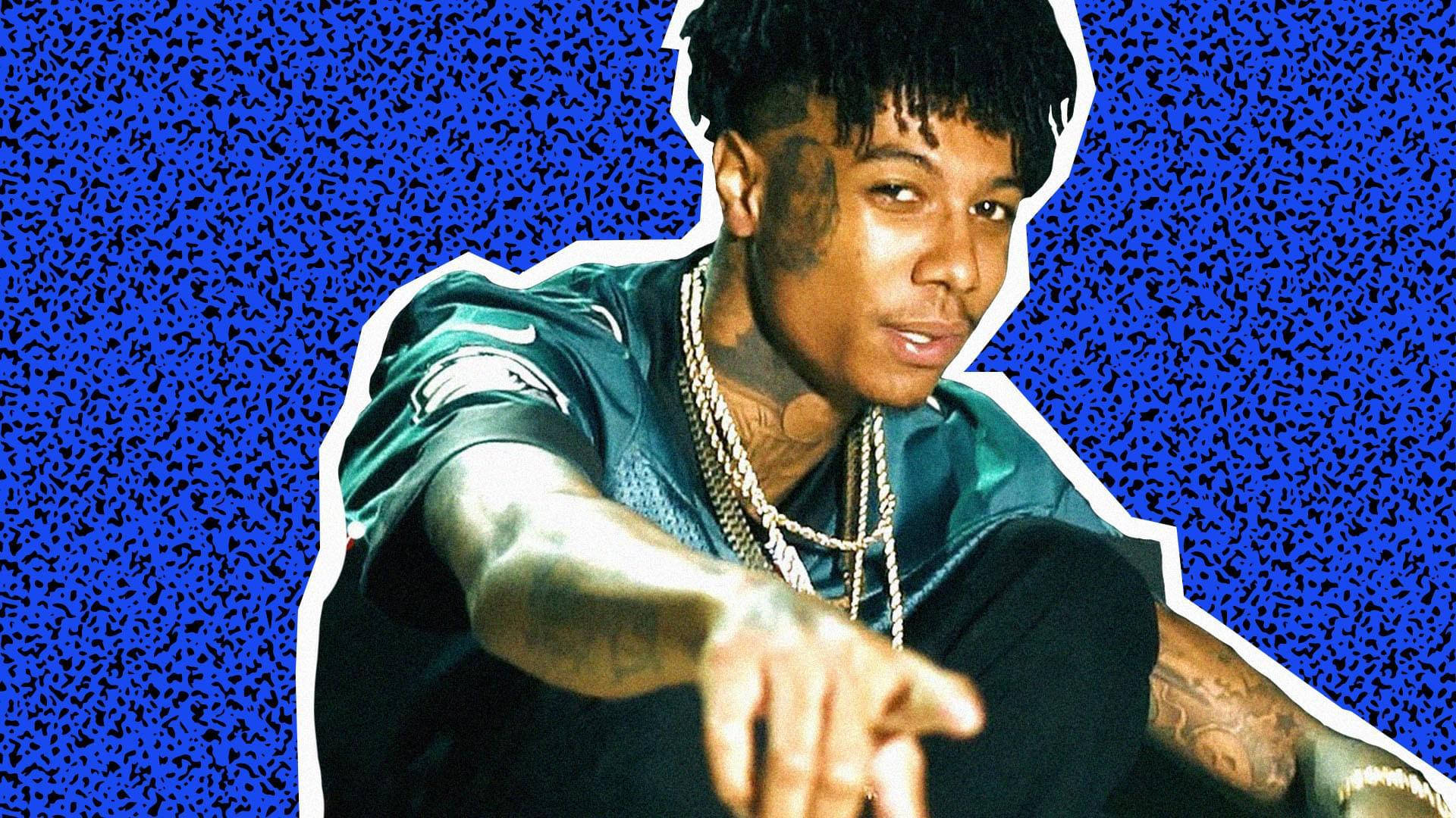 Blueface Pointing Blue Background Background