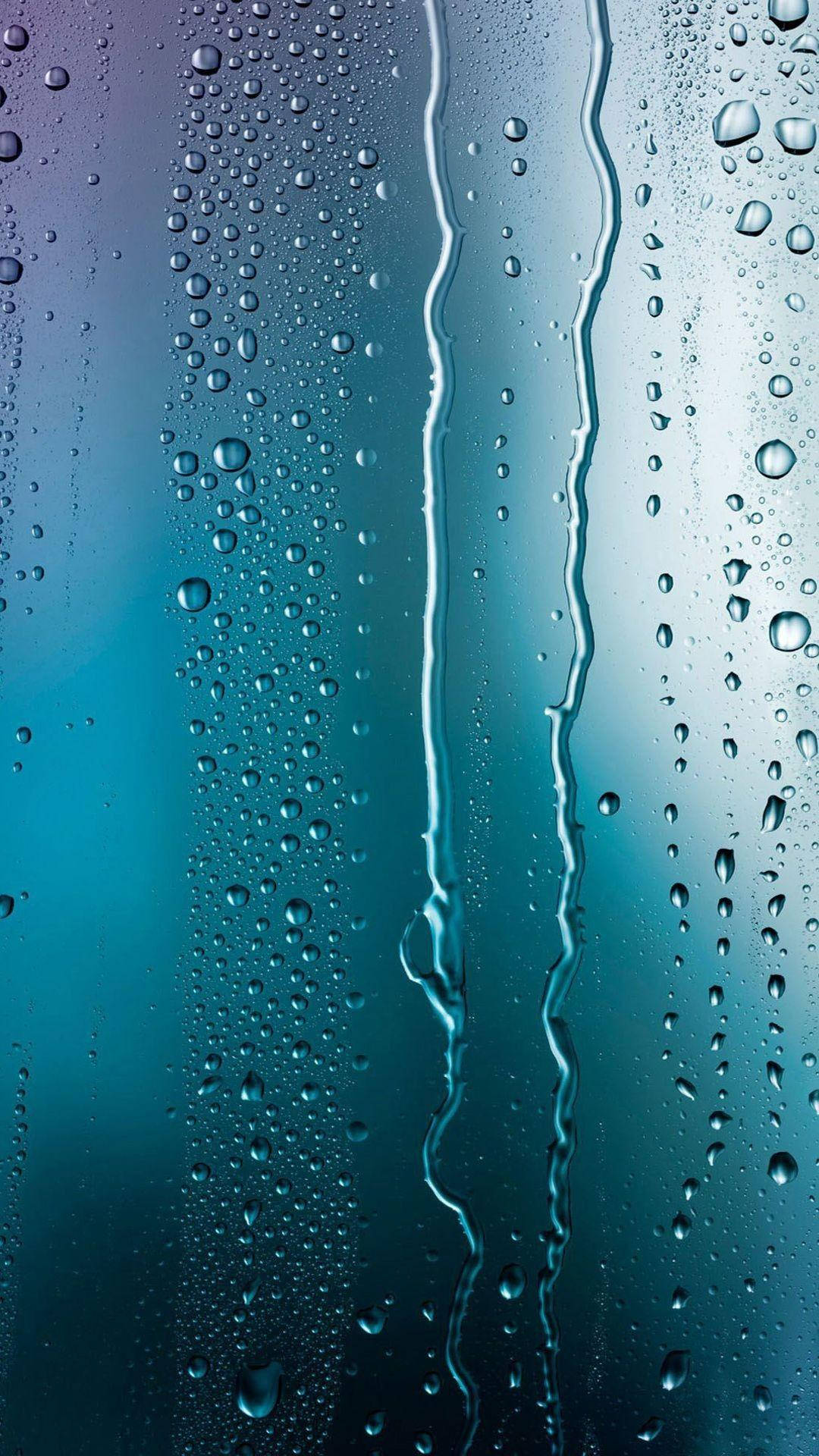 Bluish Themed Glass Pane Raindrops Background