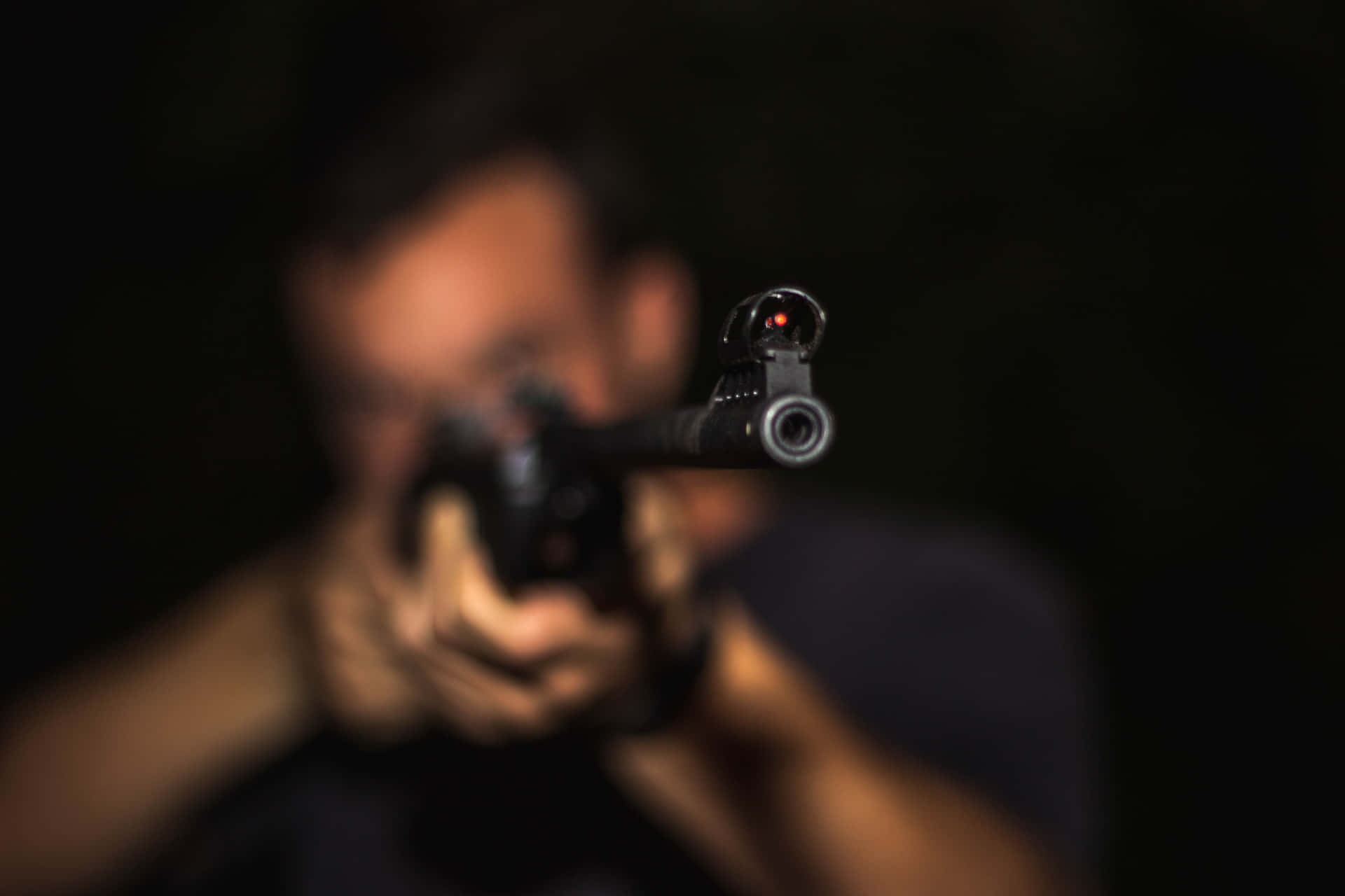 Blurred Faces Of Gangsters With Guns Background