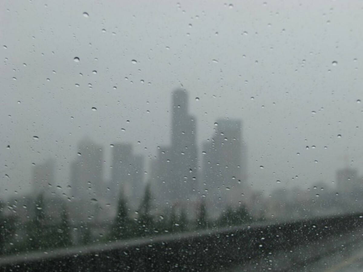 Blurry Buildings Under Seattle Rain Background