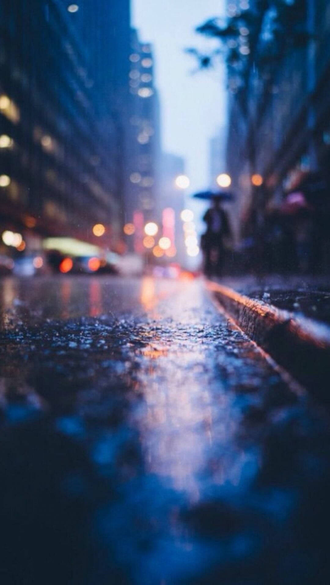 Blurry Man With Umbrella Seattle Rain Background