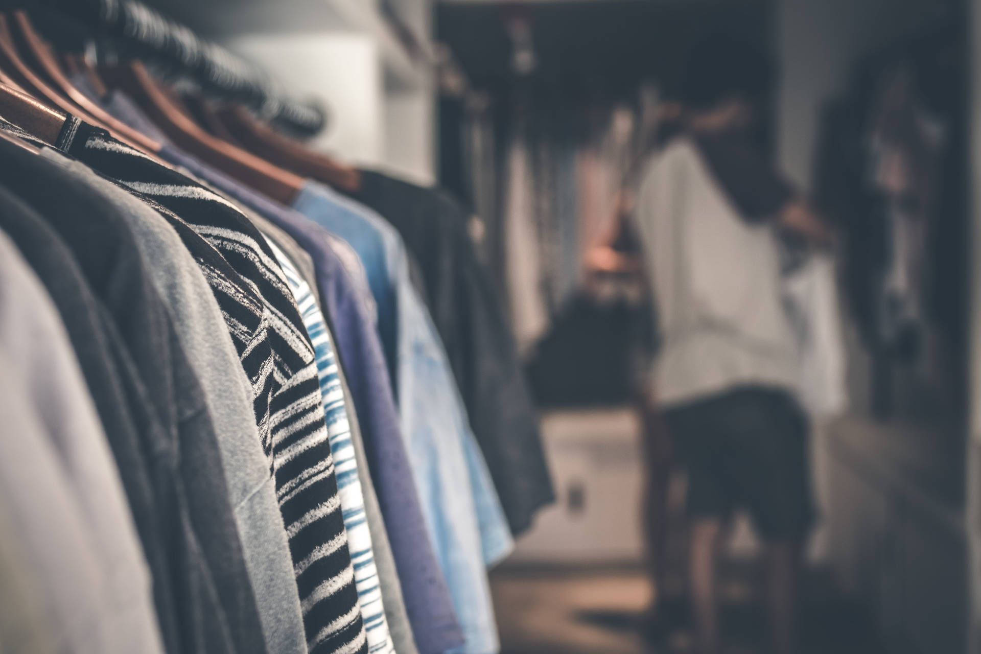 Blurry Person Choosing Clothes Background