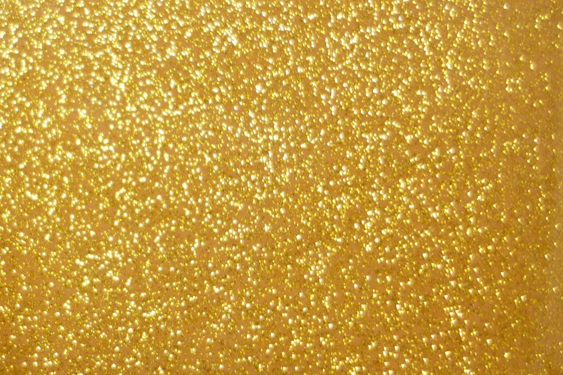 Blurry Plain Gold Glitters Background