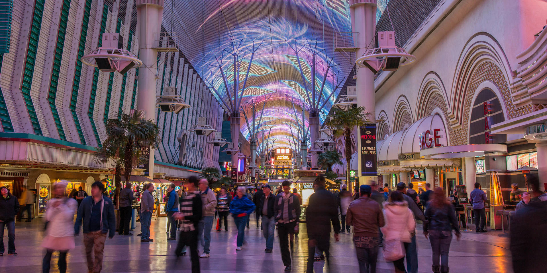 Blurry Tourists Walking Fremont Street