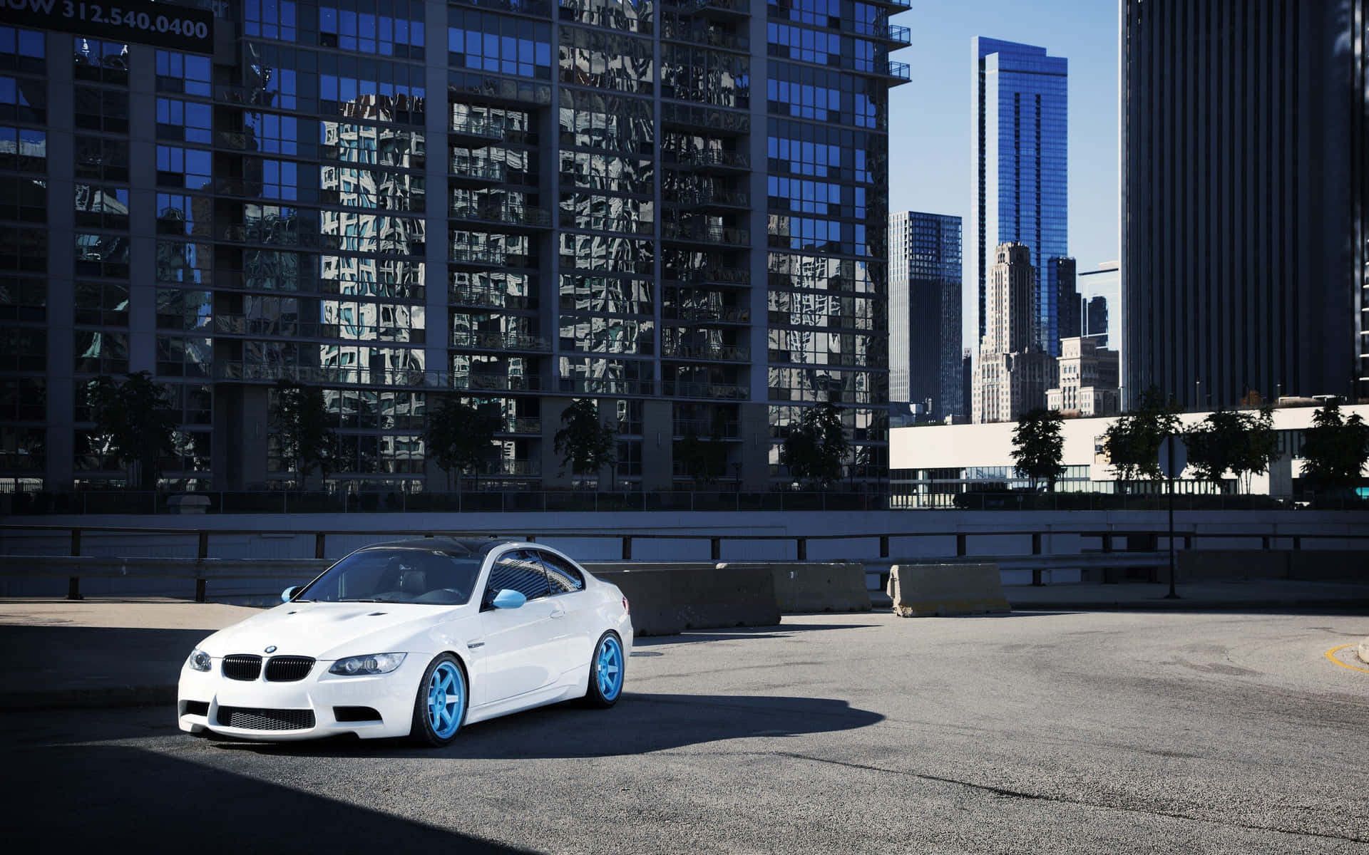 Bmw At Building Rooftop Parking Lot Background