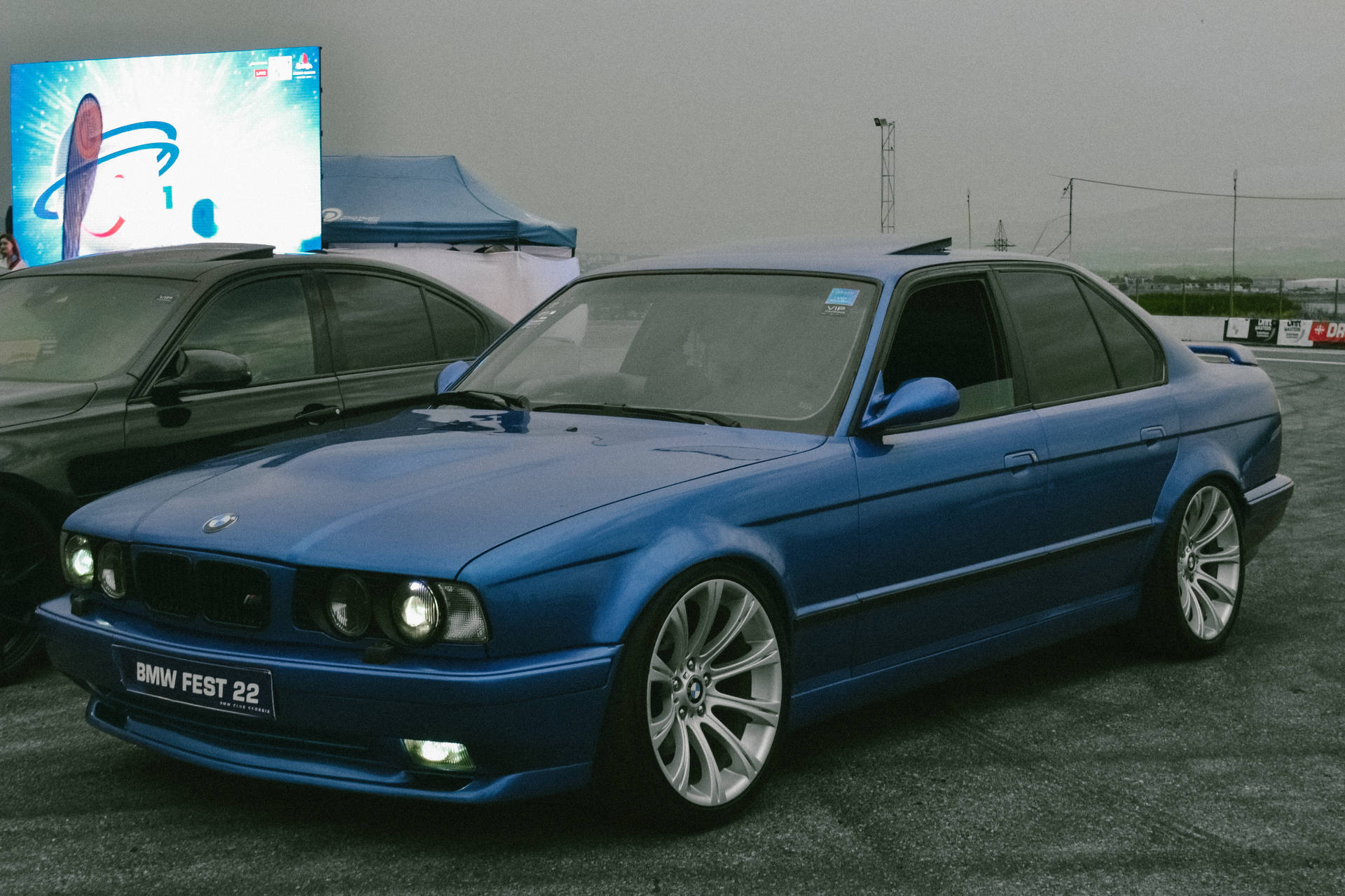 Bmw E34 At Racing Track Background