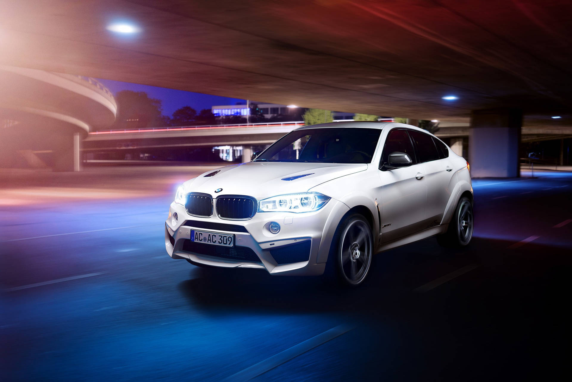 Bmw X6 M Under An Overpass Background