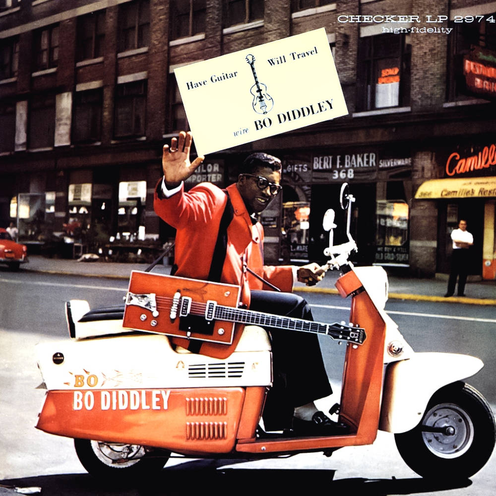 Bo Diddley Riding Orange Motorcycle Background