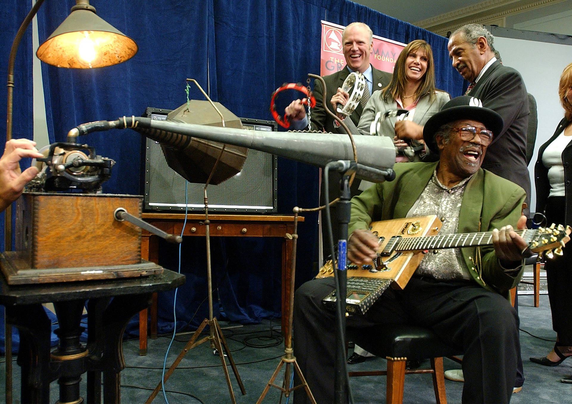 Bo Diddley Singing In A Studio Background