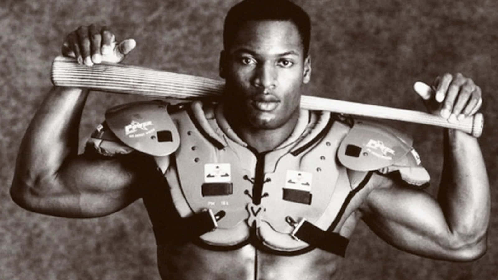 Bo Jackson With A Football Vest Background