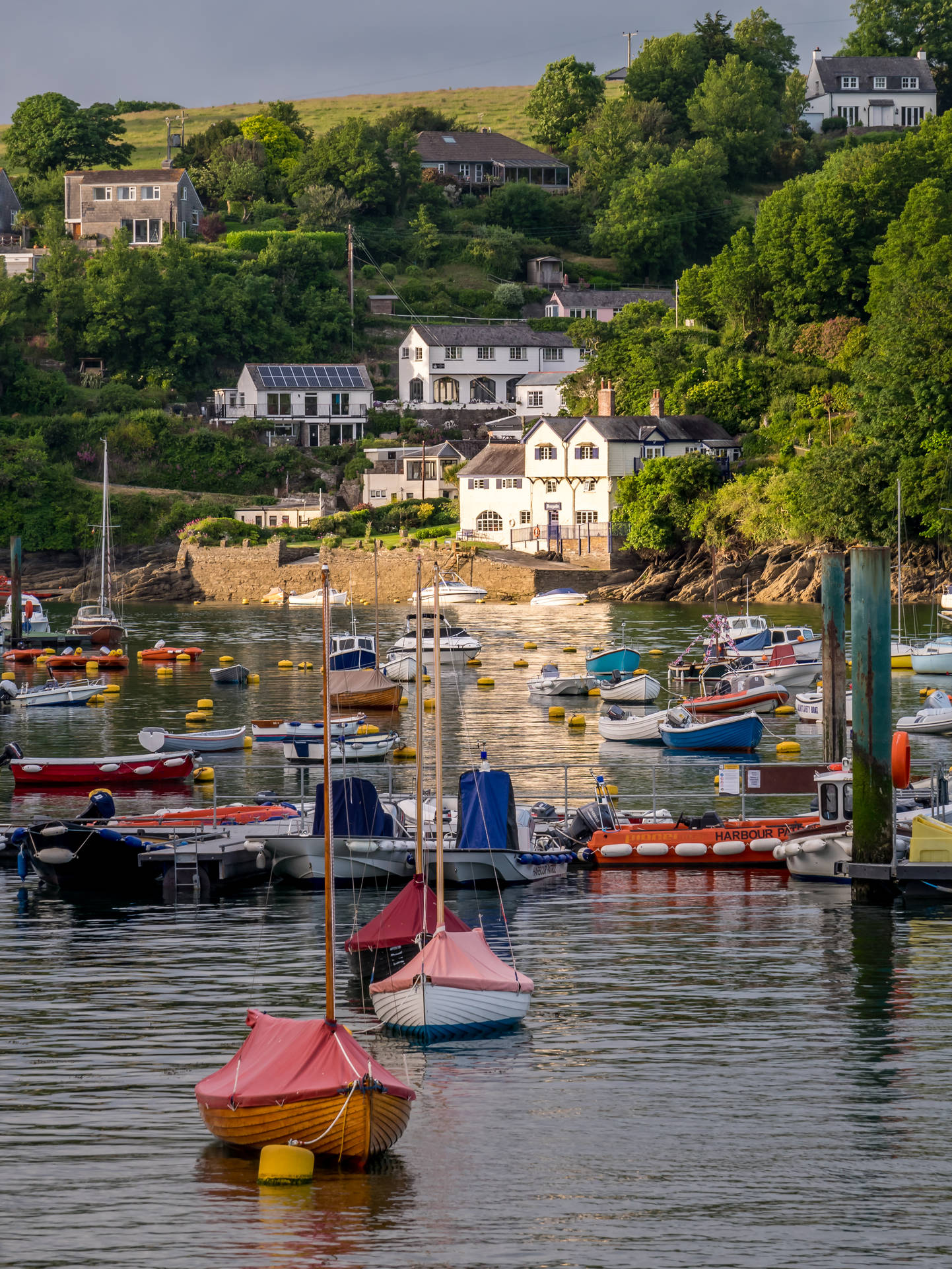 Boat Below Bay View Houses Background