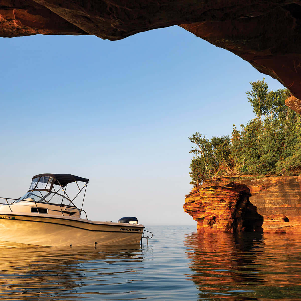 Boat Near Sea Cave Background