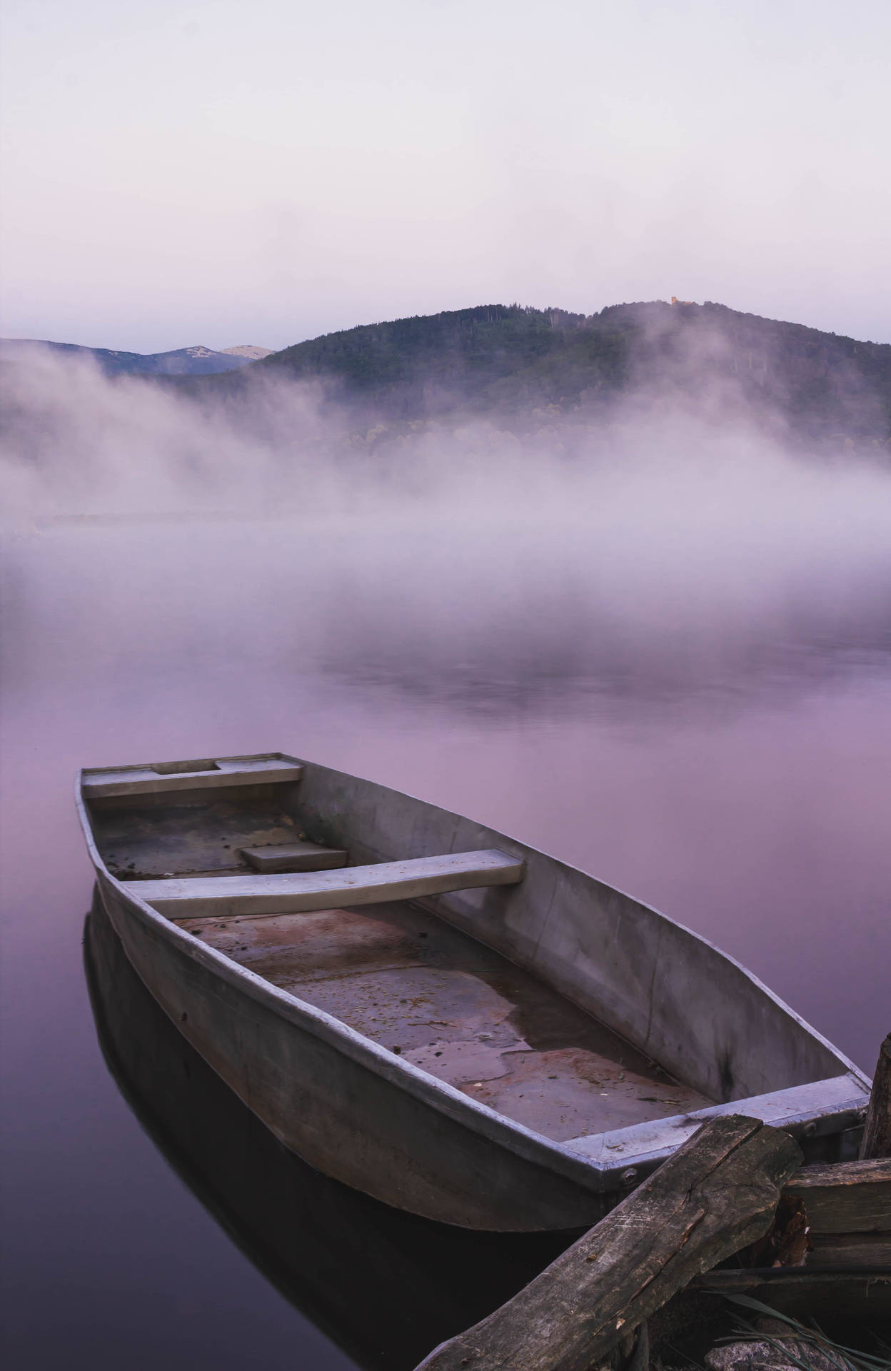 Boat On A Foggy Lake Background