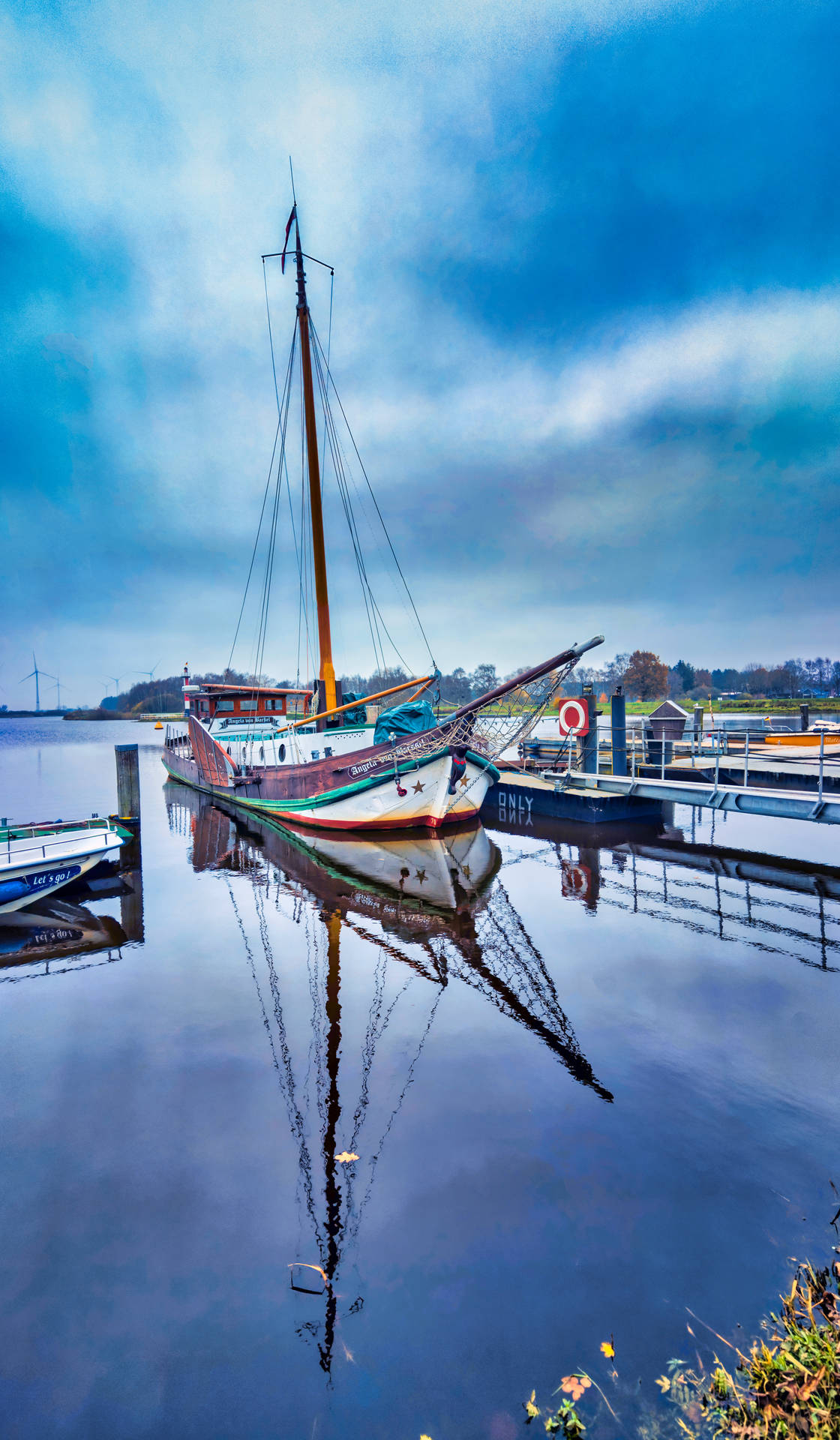 Boat Reflection In Calm Water Background