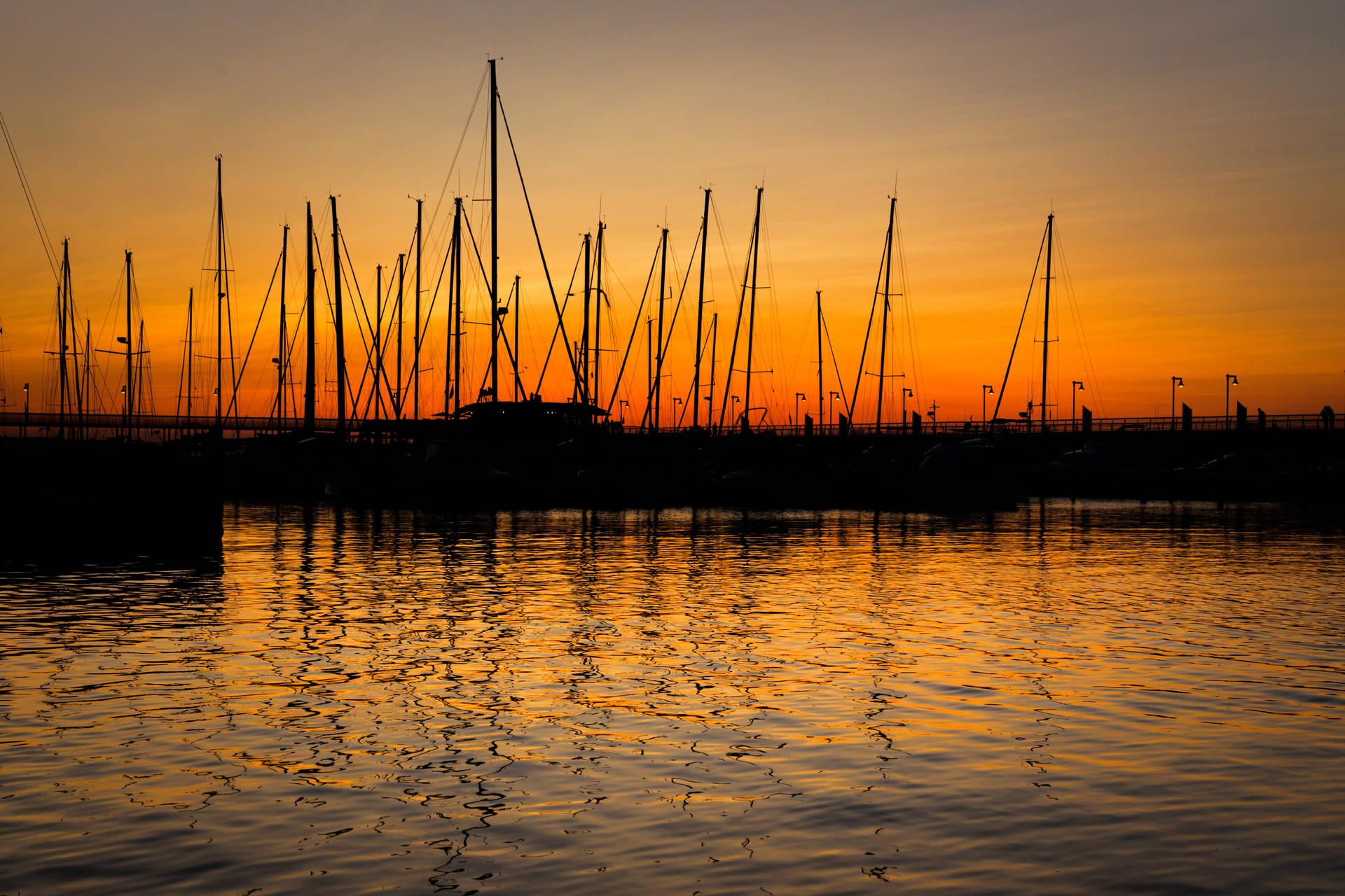 Boat Silhouette In The Harbor Background