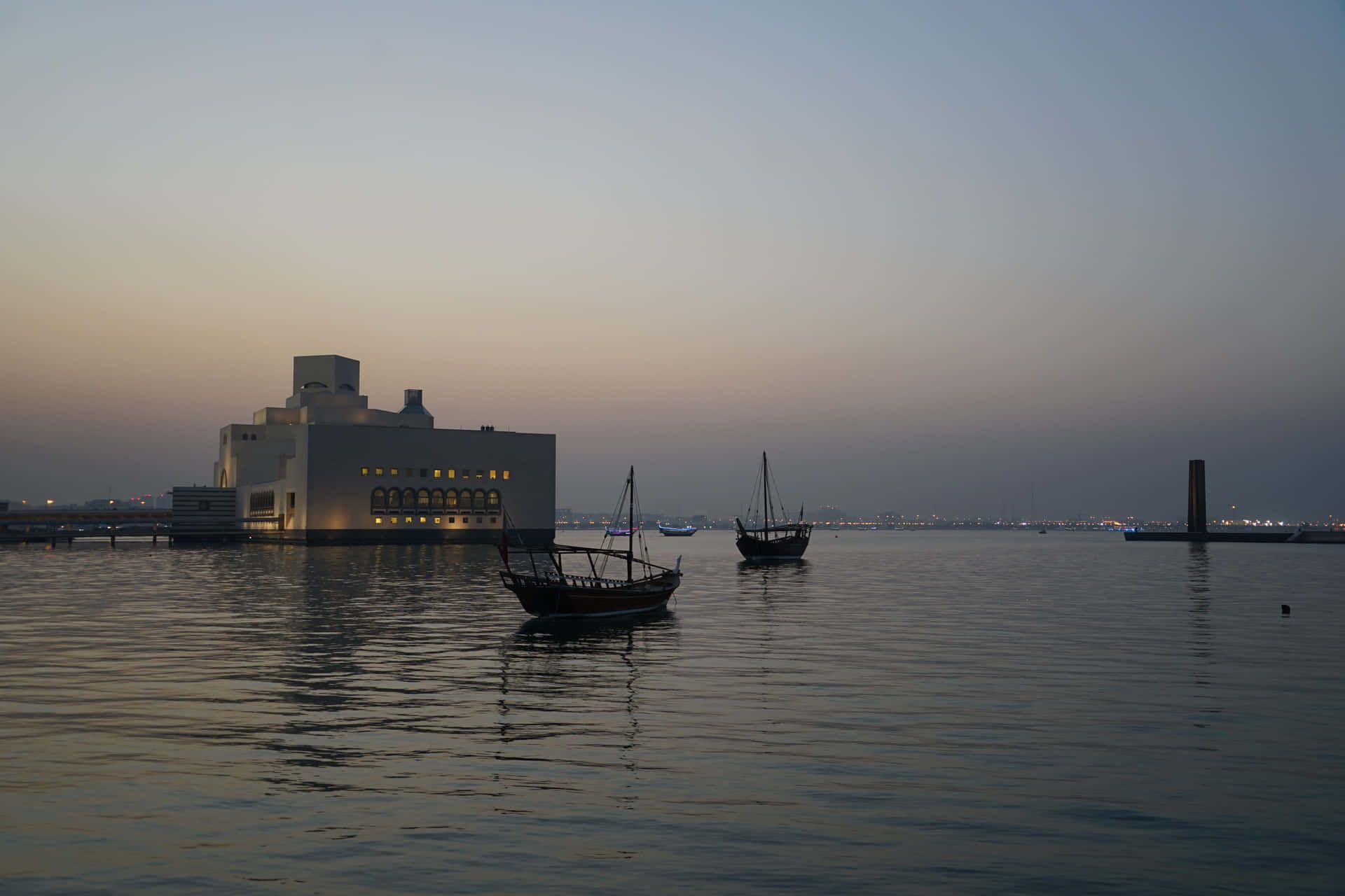 Boats At Dusk Near Museum Of Islamic Art Background
