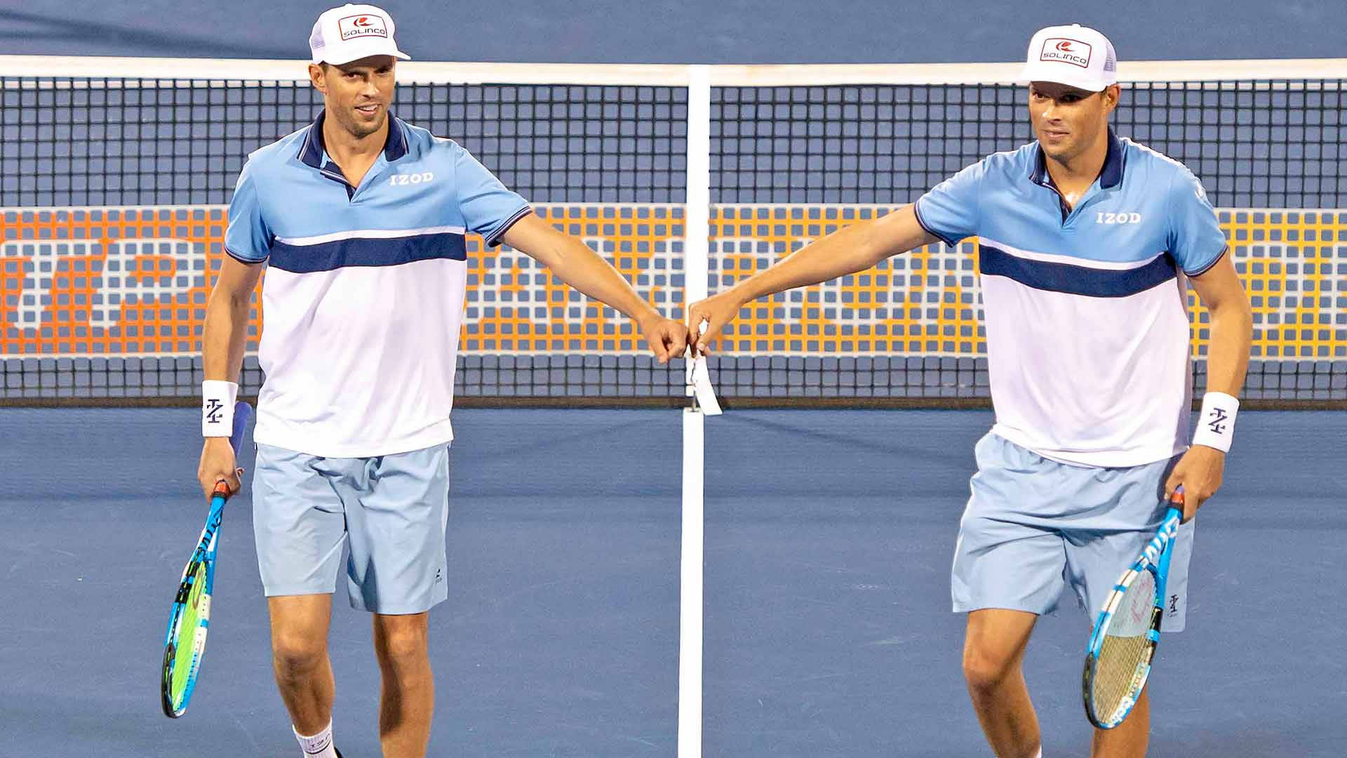 Bob Bryan Fist Bump With Mike Background