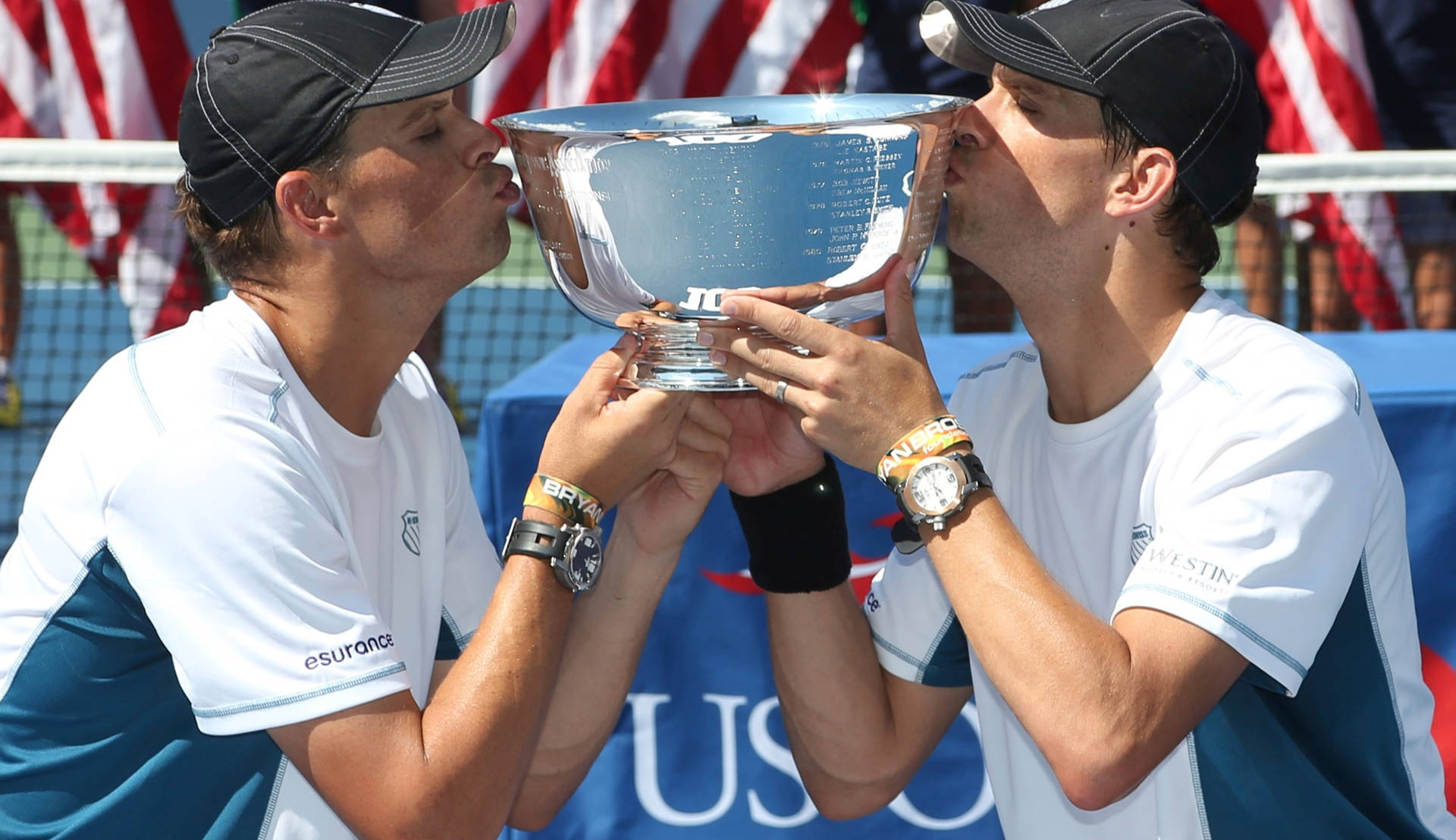 Bob Bryan Kissing Trophy With Mike Background