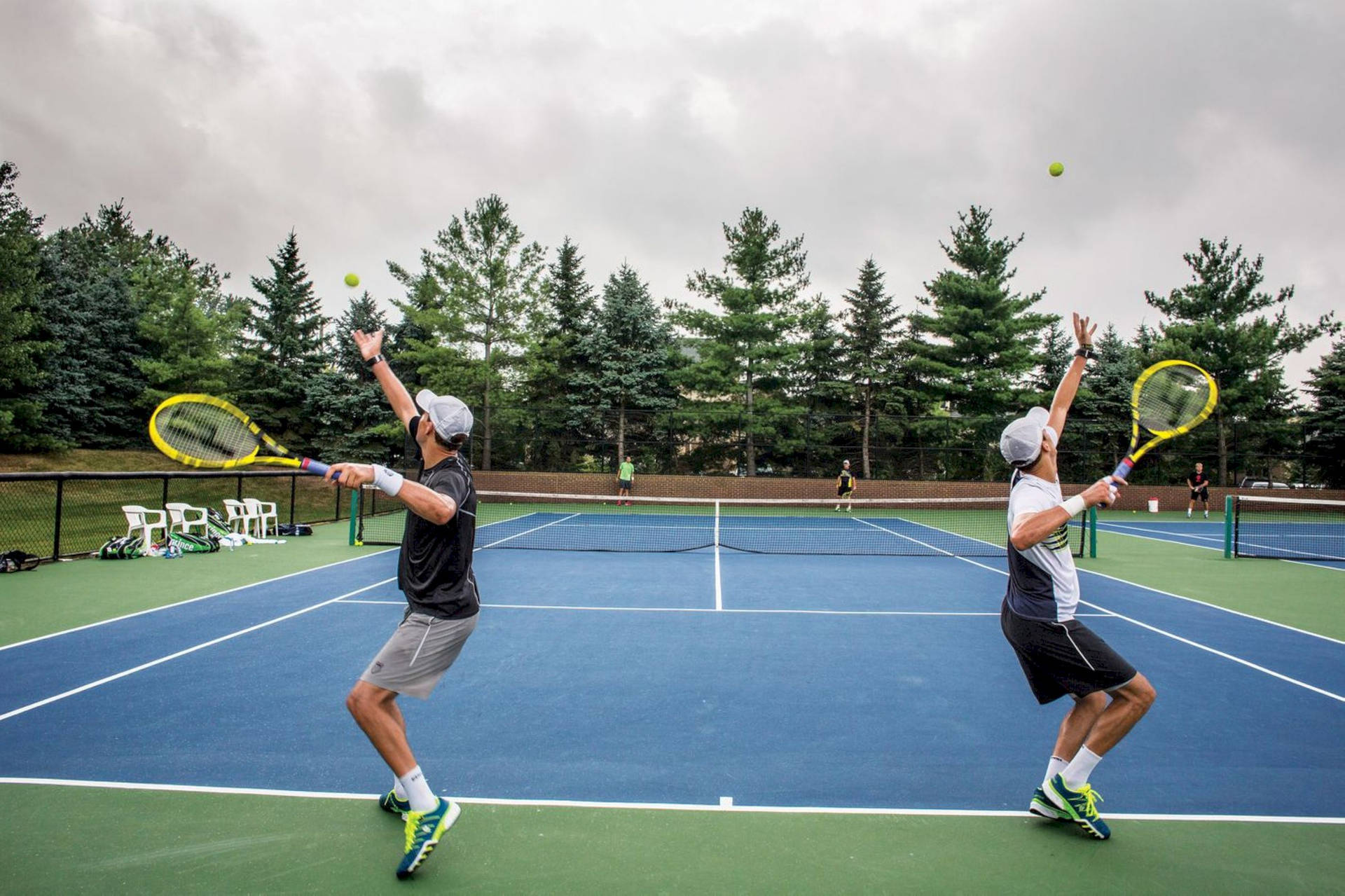 Bob Bryan Serve With Brother Mike Background