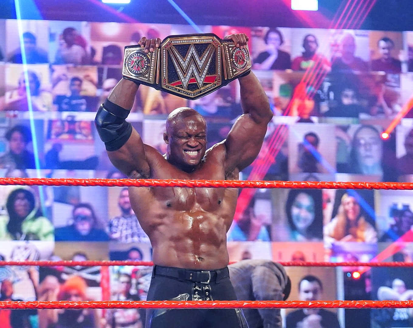 Bobby Lashley Holding His Championship Belt Over His Head Background