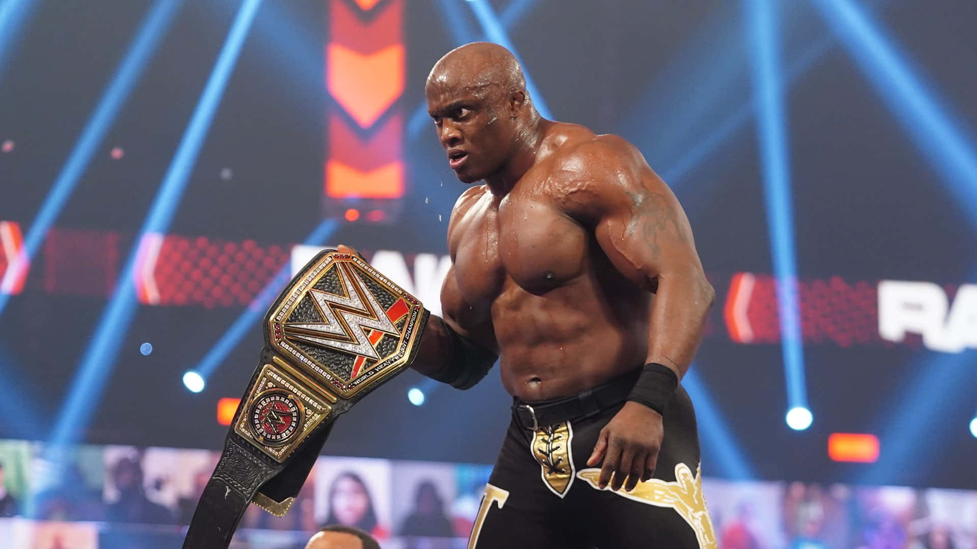 Bobby Lashley Triumphantly Holding Wwe Championship Belt Background