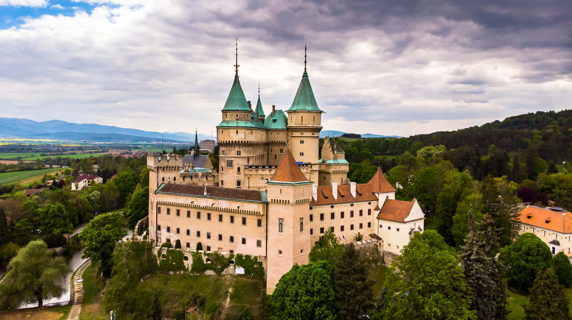 Bojnice Castle Beneath Blue Cloudy Sky Background
